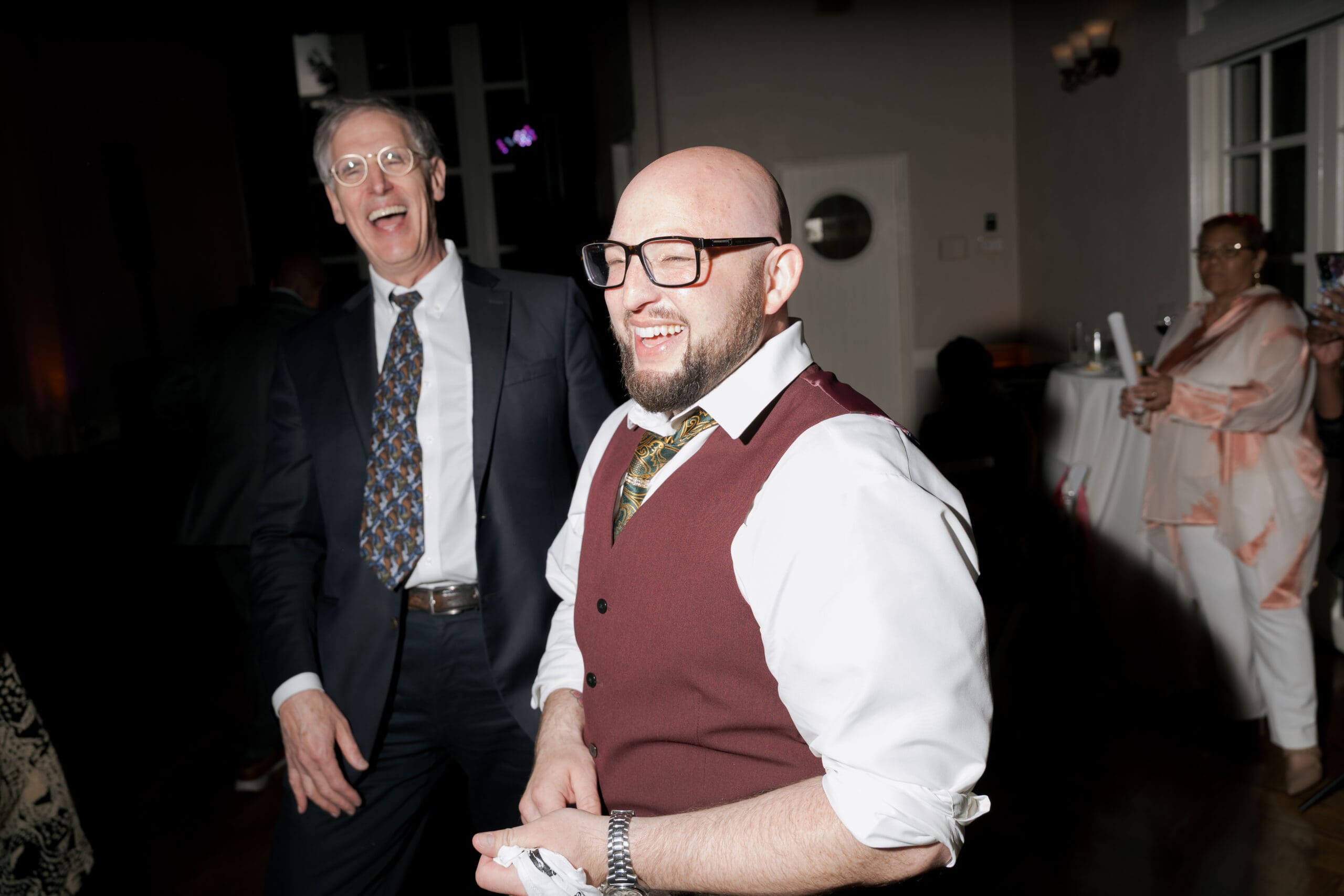 The groom was all smiles at the dark reception dance floor