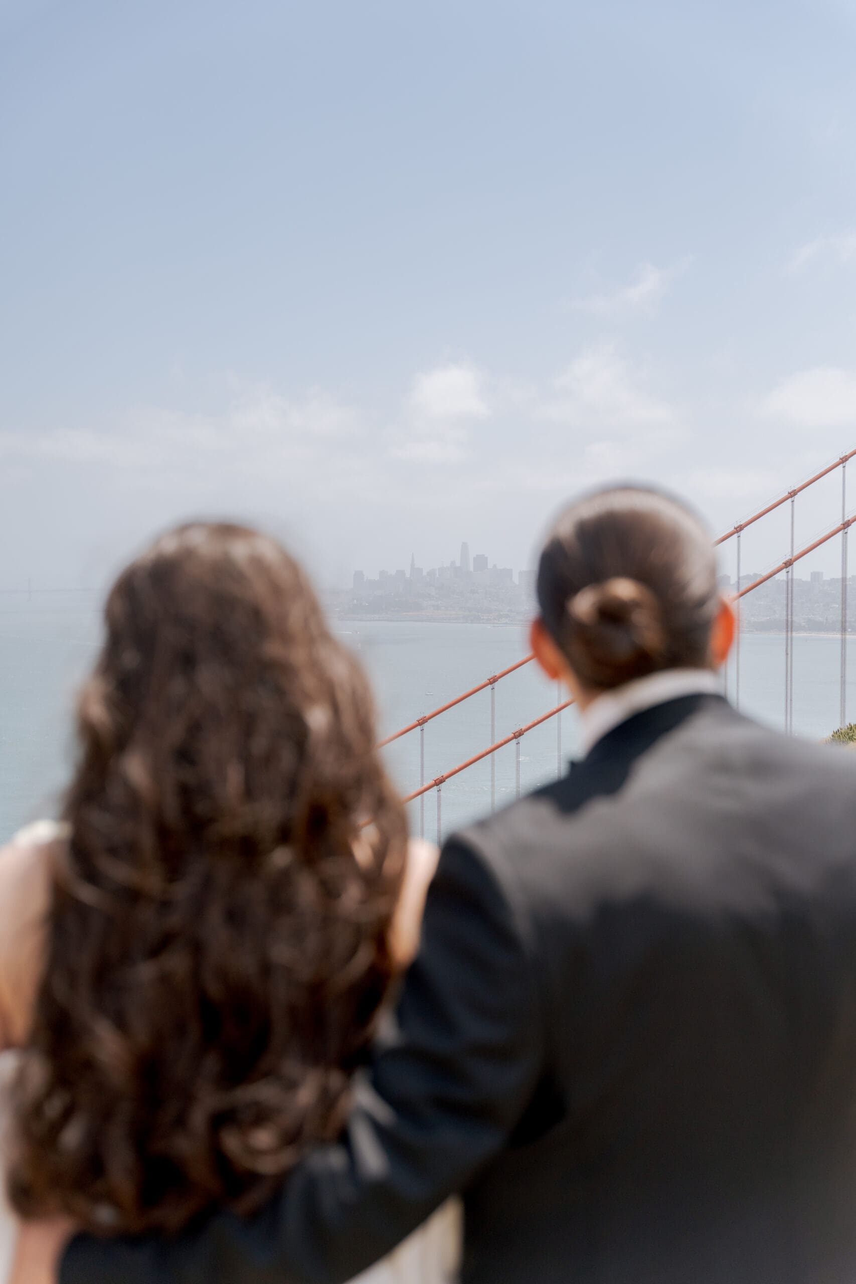 Newlyweds eloping with the Golden Gate Bridge in the background