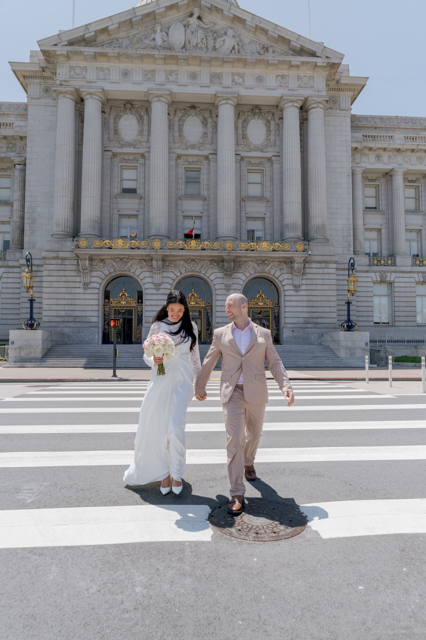 Crossing the street in front of San Francisco City Hall