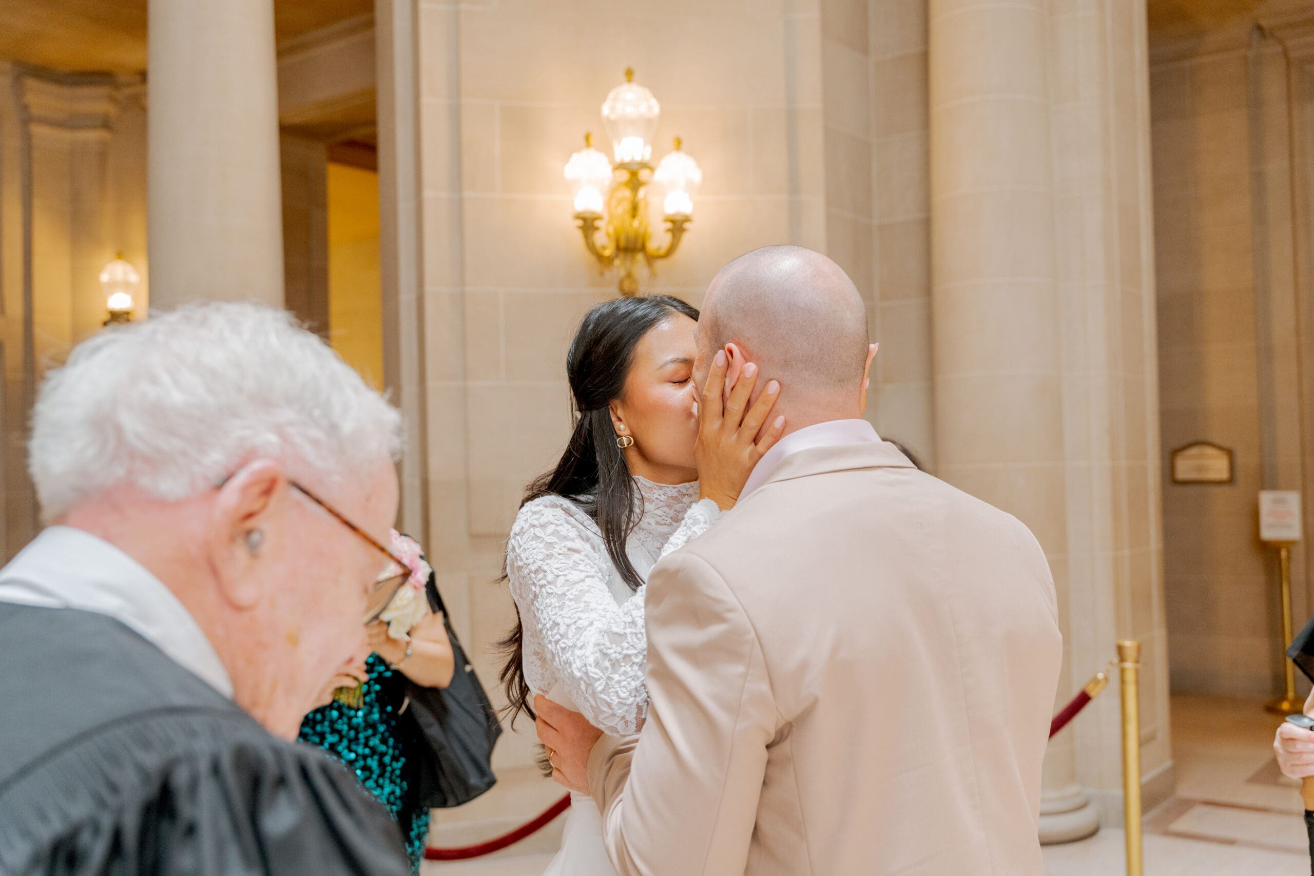 A first kiss between husband and wife at SF City Hall