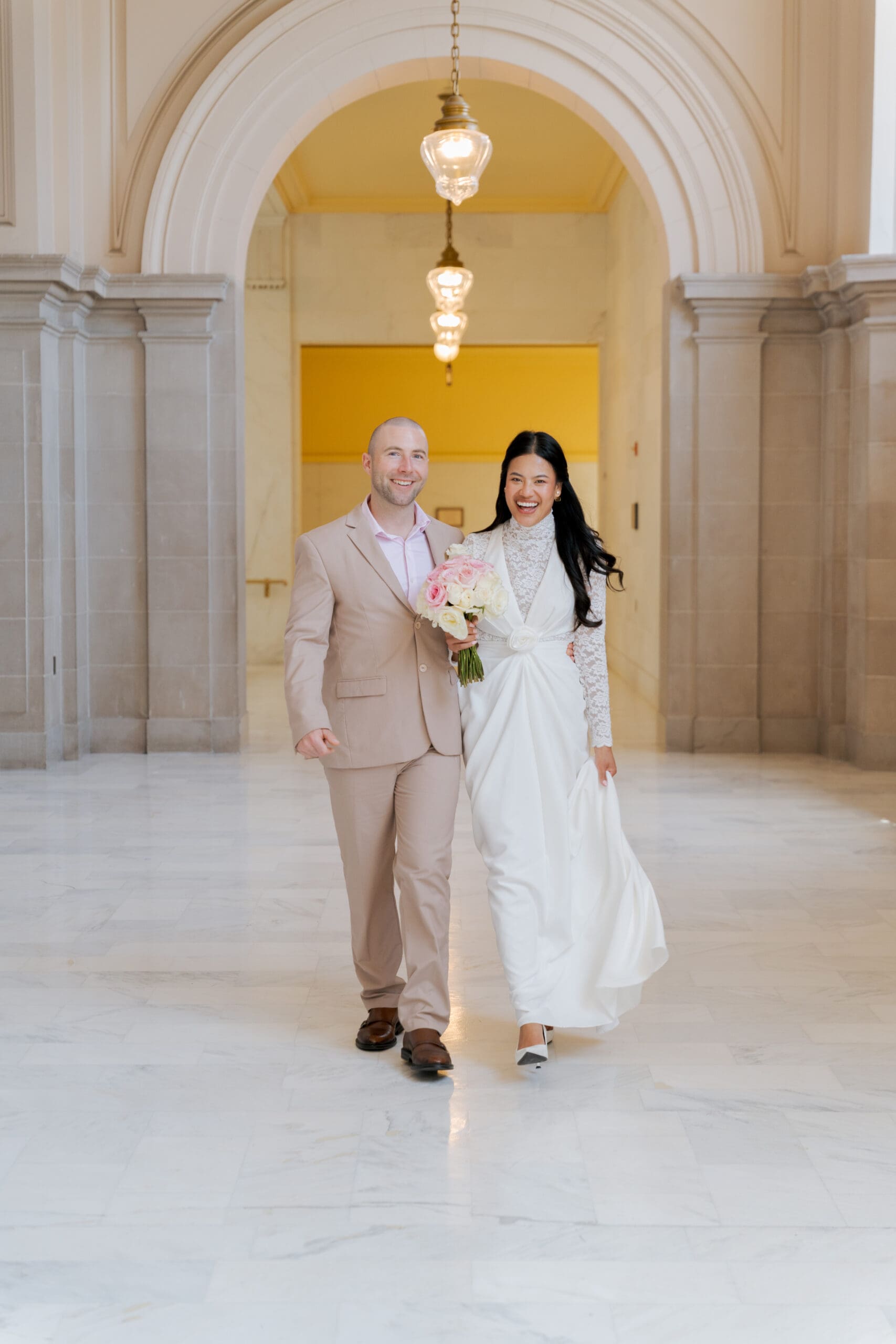 All smiles for the newlyweds on the 4th floor of San Francisco City Hall