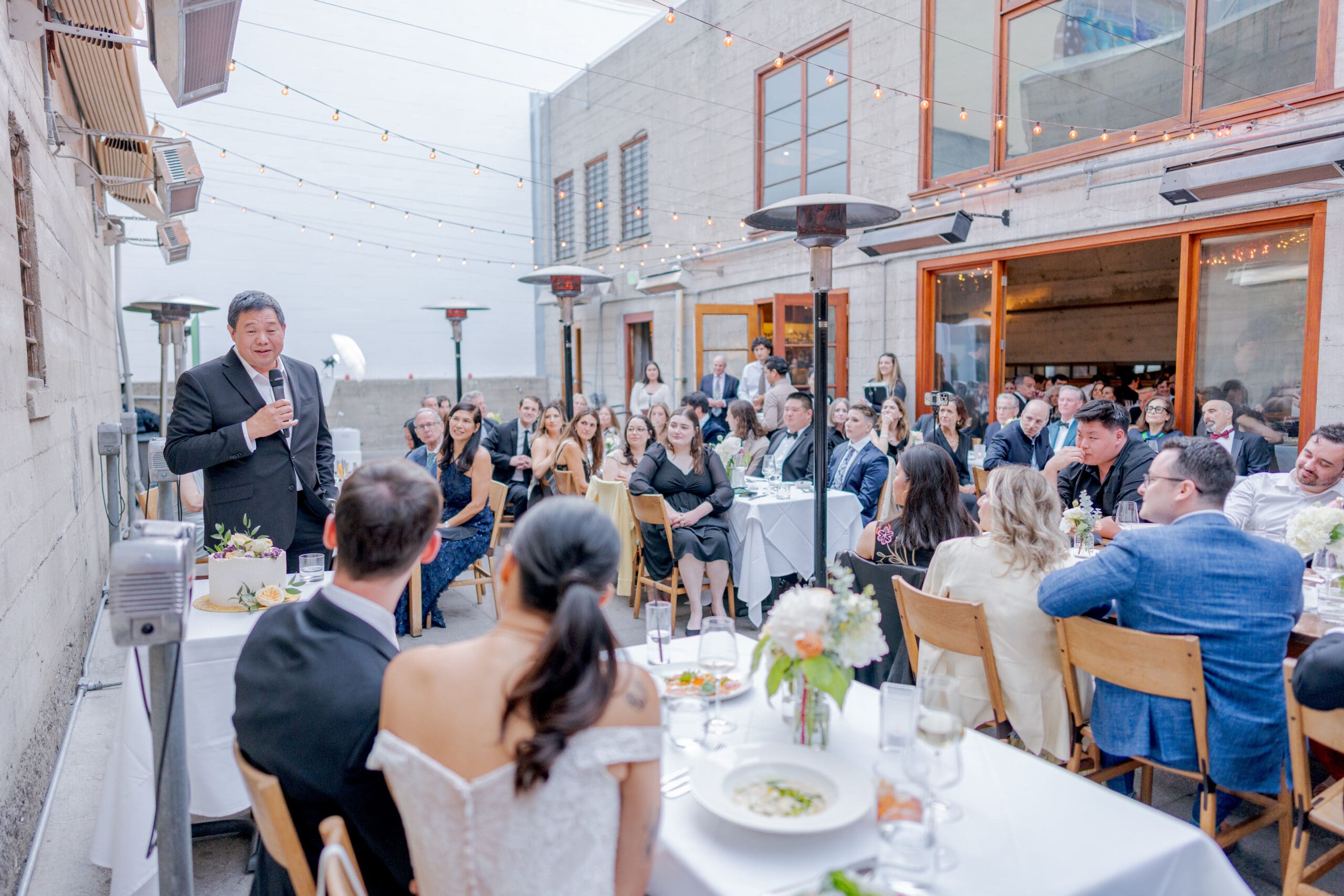 Father of the bride giving a toast during dinner at Foreign Cinema
