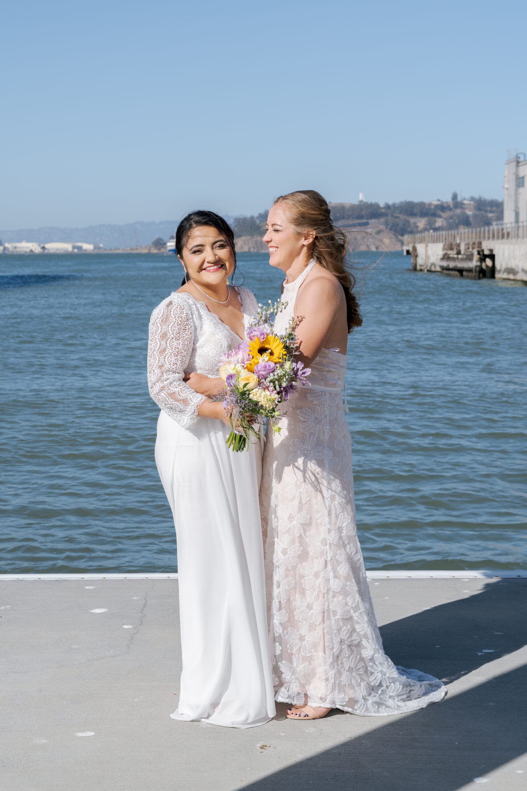 Beaming brides on their wedding day on the San Francisco waterfront