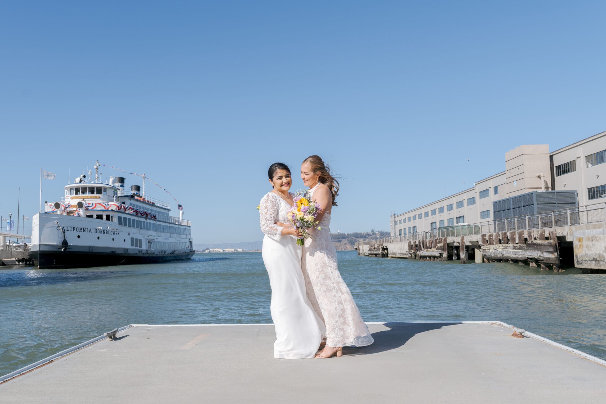 A pause in the afternoon for more couple photos outside of LaMar restaurant's waterfront