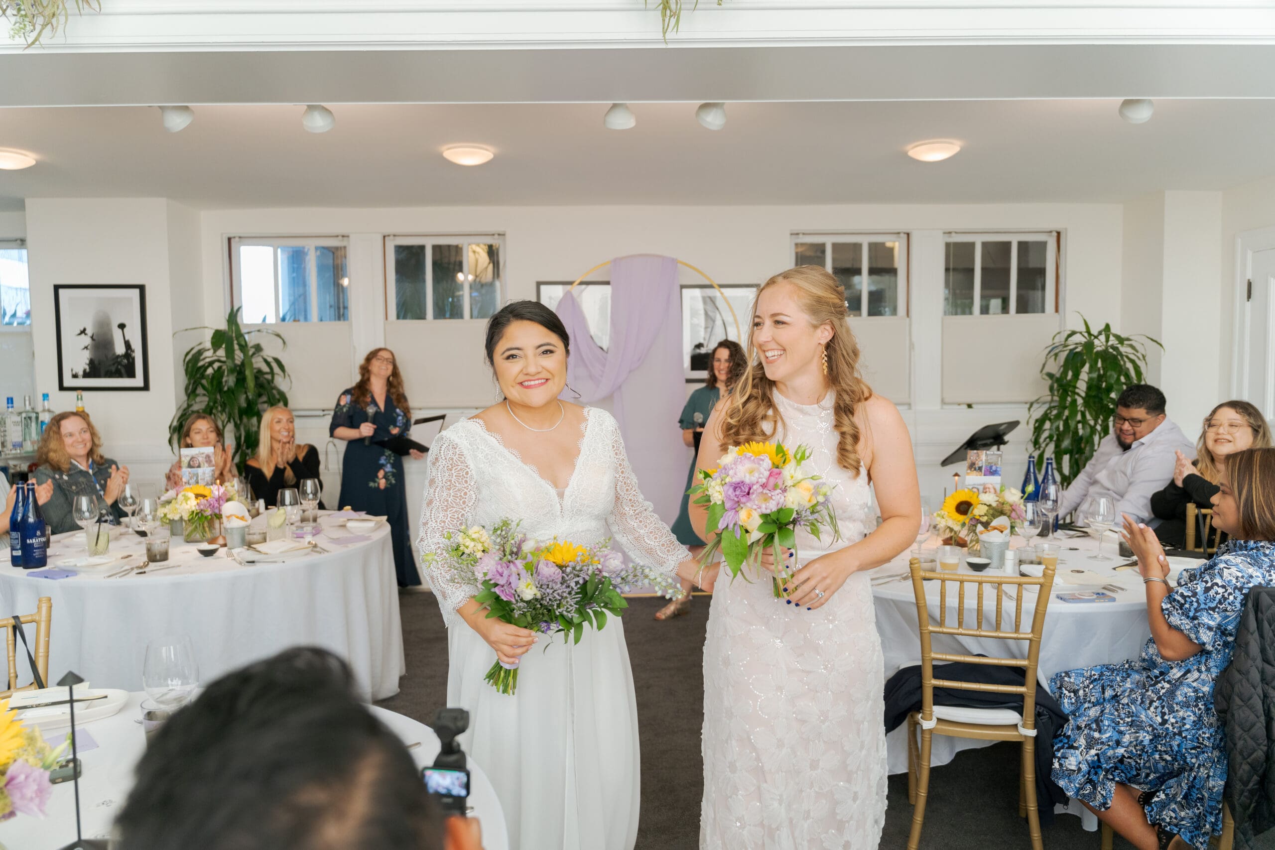 Post-ceremony glow from both brides