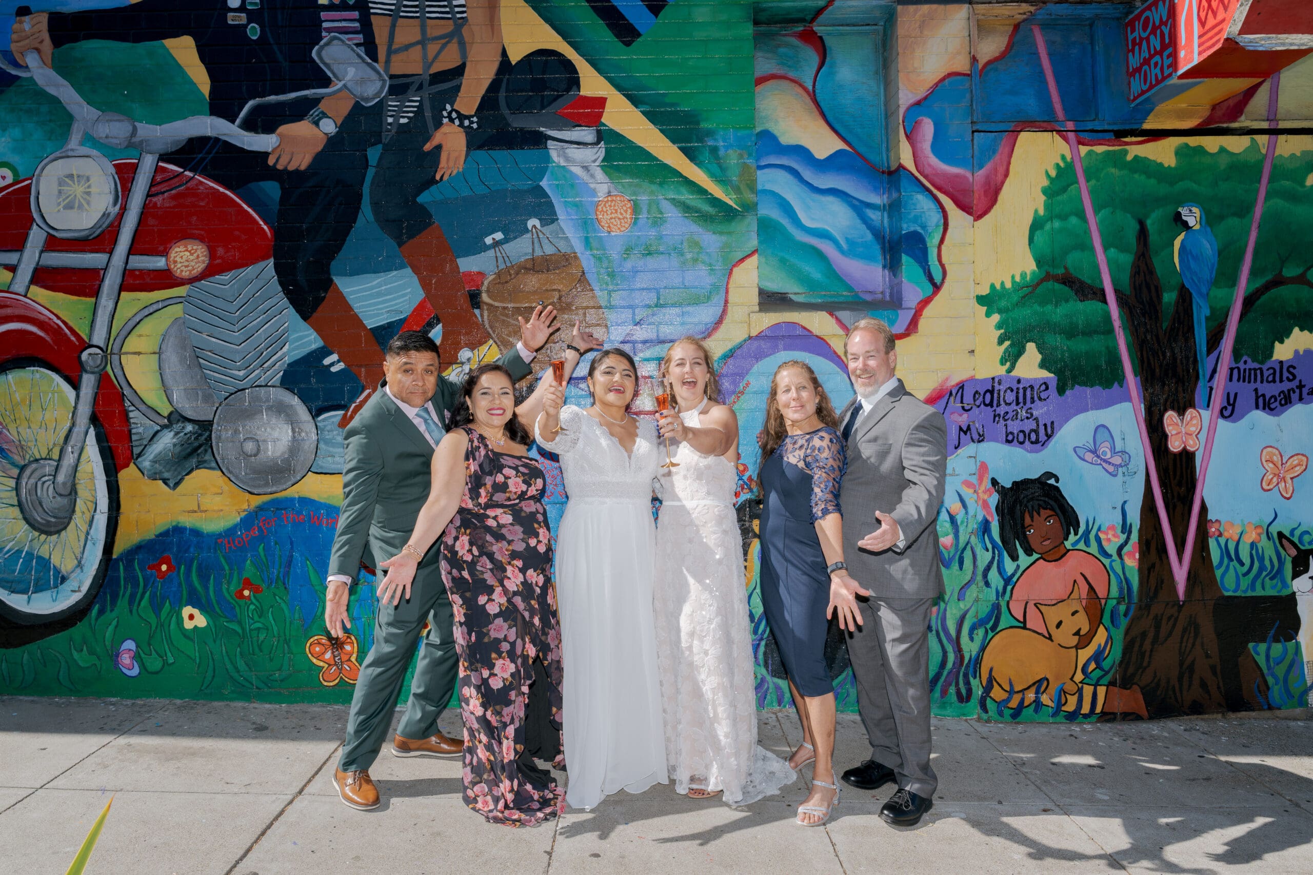Family portraits by the Hope for the World Cure Mural
