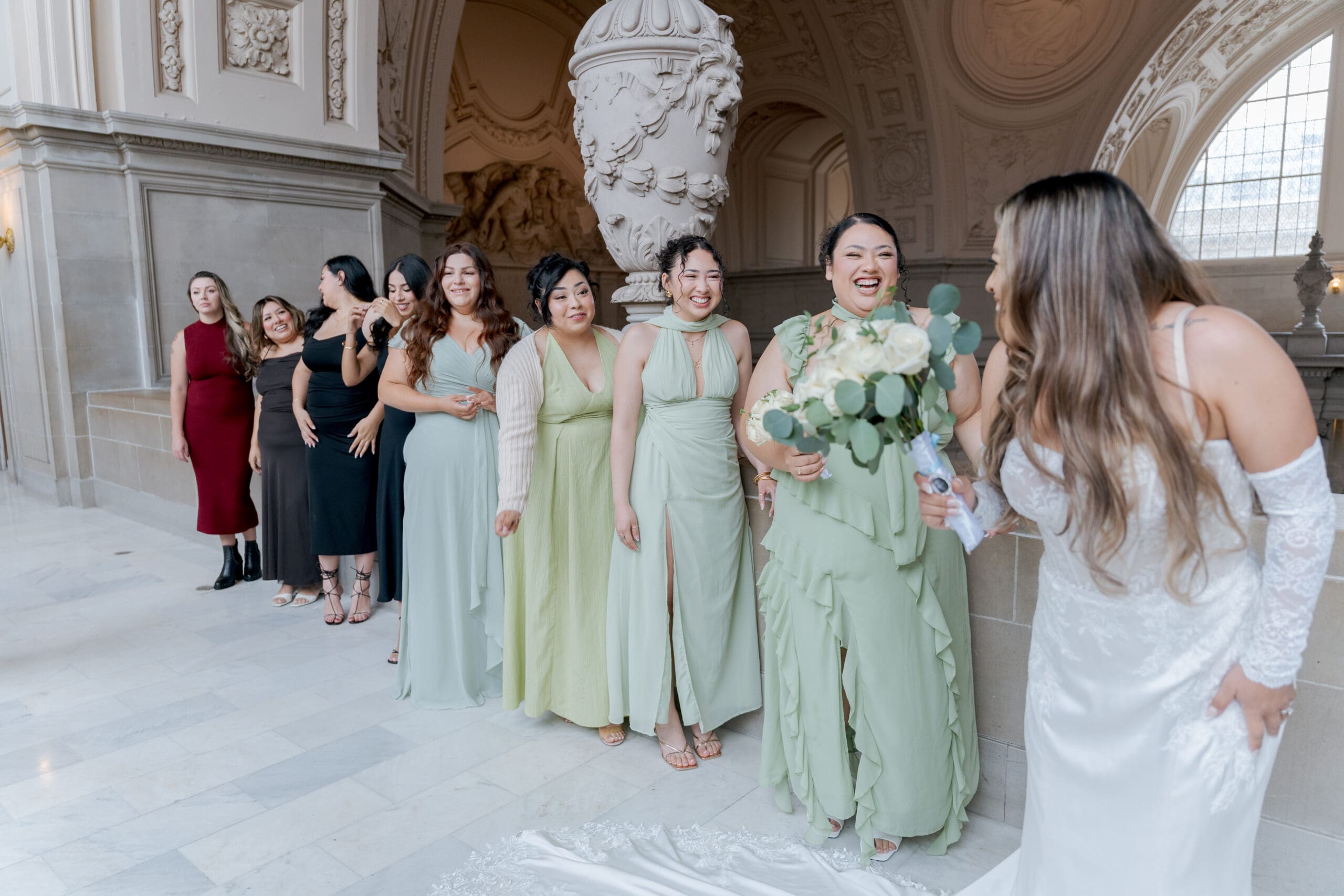 Bridesmaids with accenting colors on San Francisco City Hall 4th floor wedding