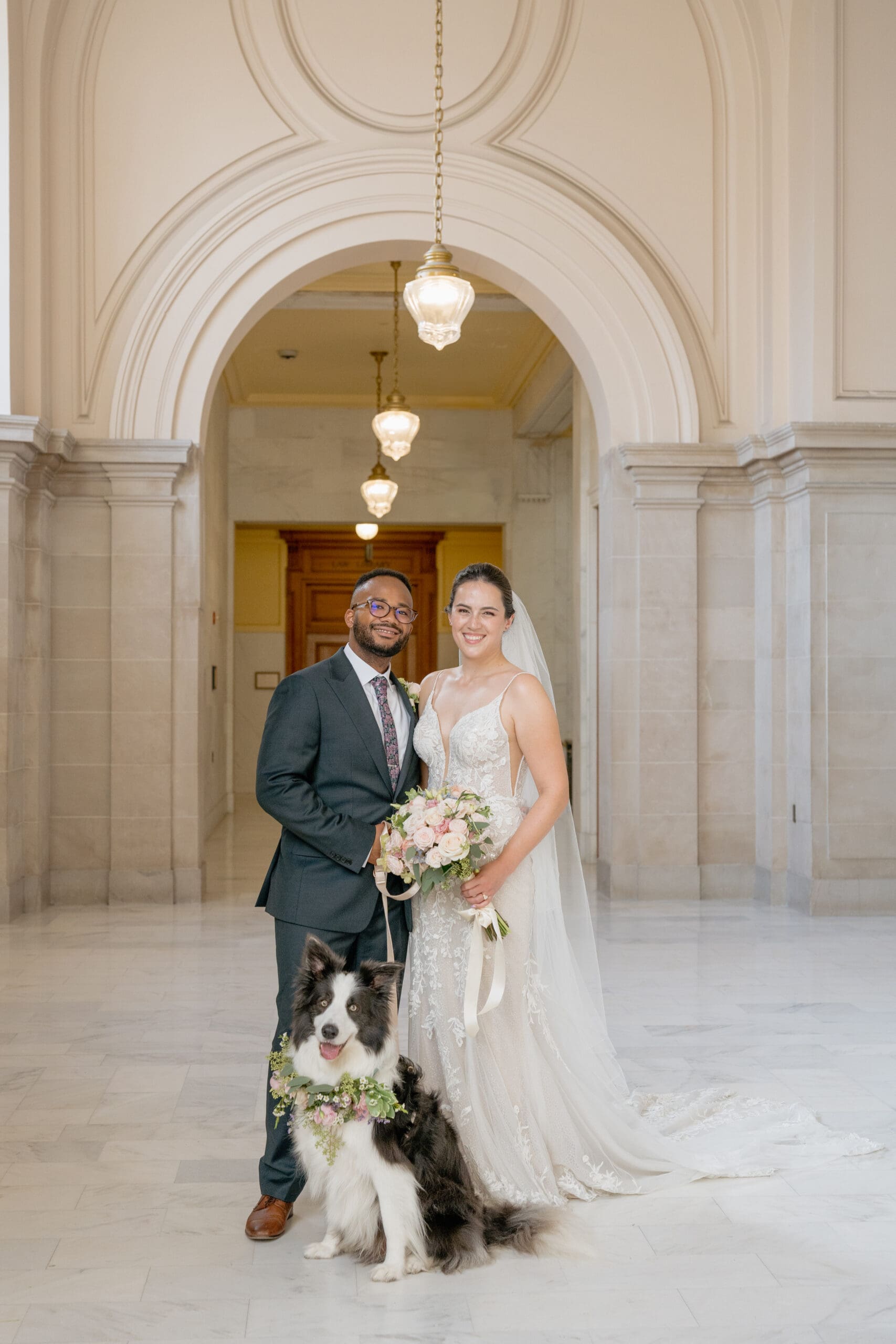 Formal wedding portrait on the Fourth Floor North Gallery of SF City Hall