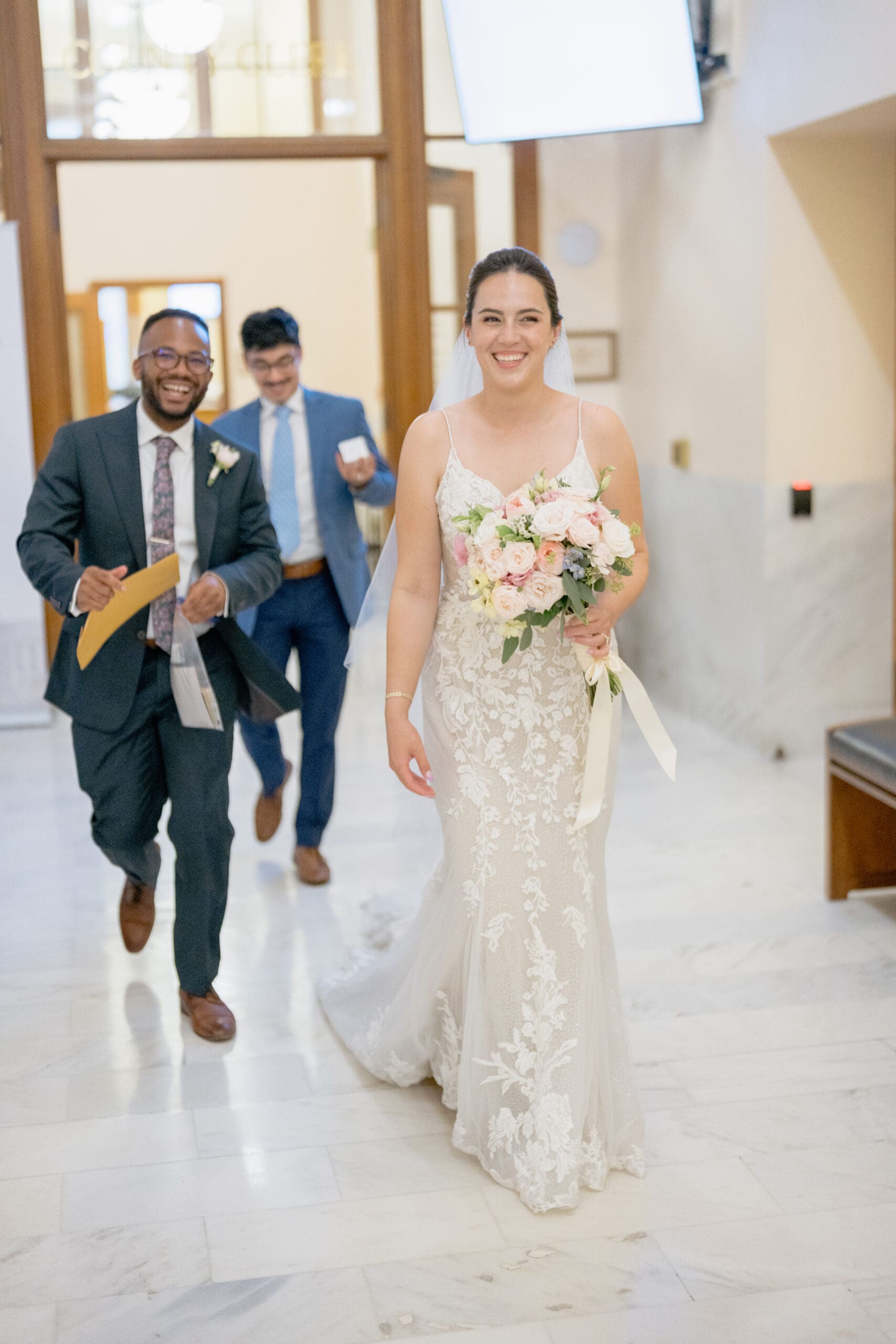 Bride and Groom outside the San Francisco County Clerk's office on the first floor of San Francisco City Hall