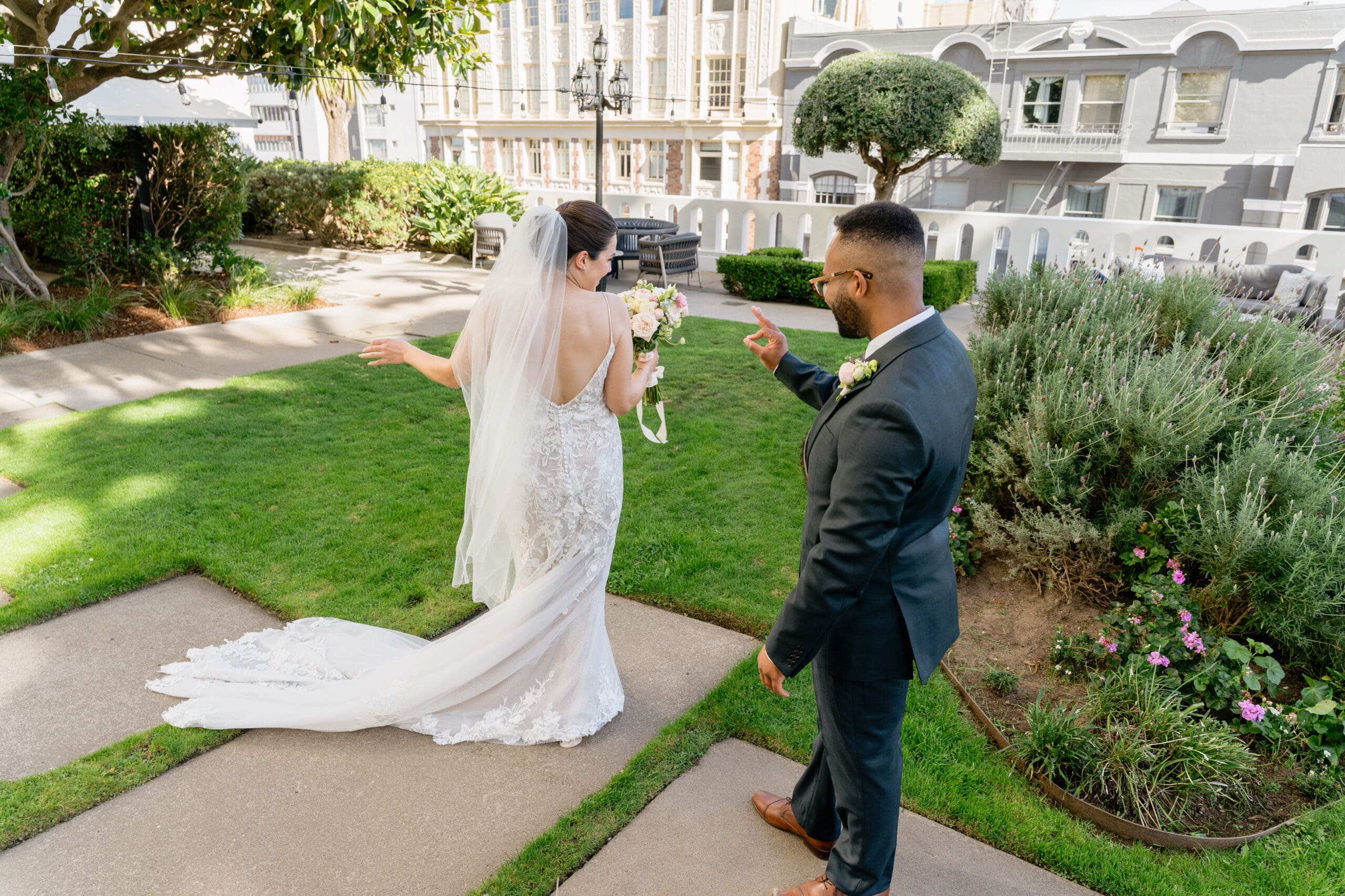 First Look at the Fairmont. Bride and groom sharing a private first look in the Fairmont Hotel rooftop garden
