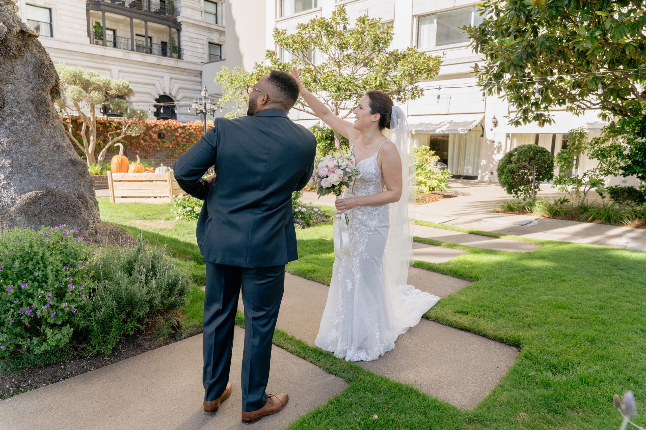 Intimate first look moment between couple in the Fairmont Hotel garden