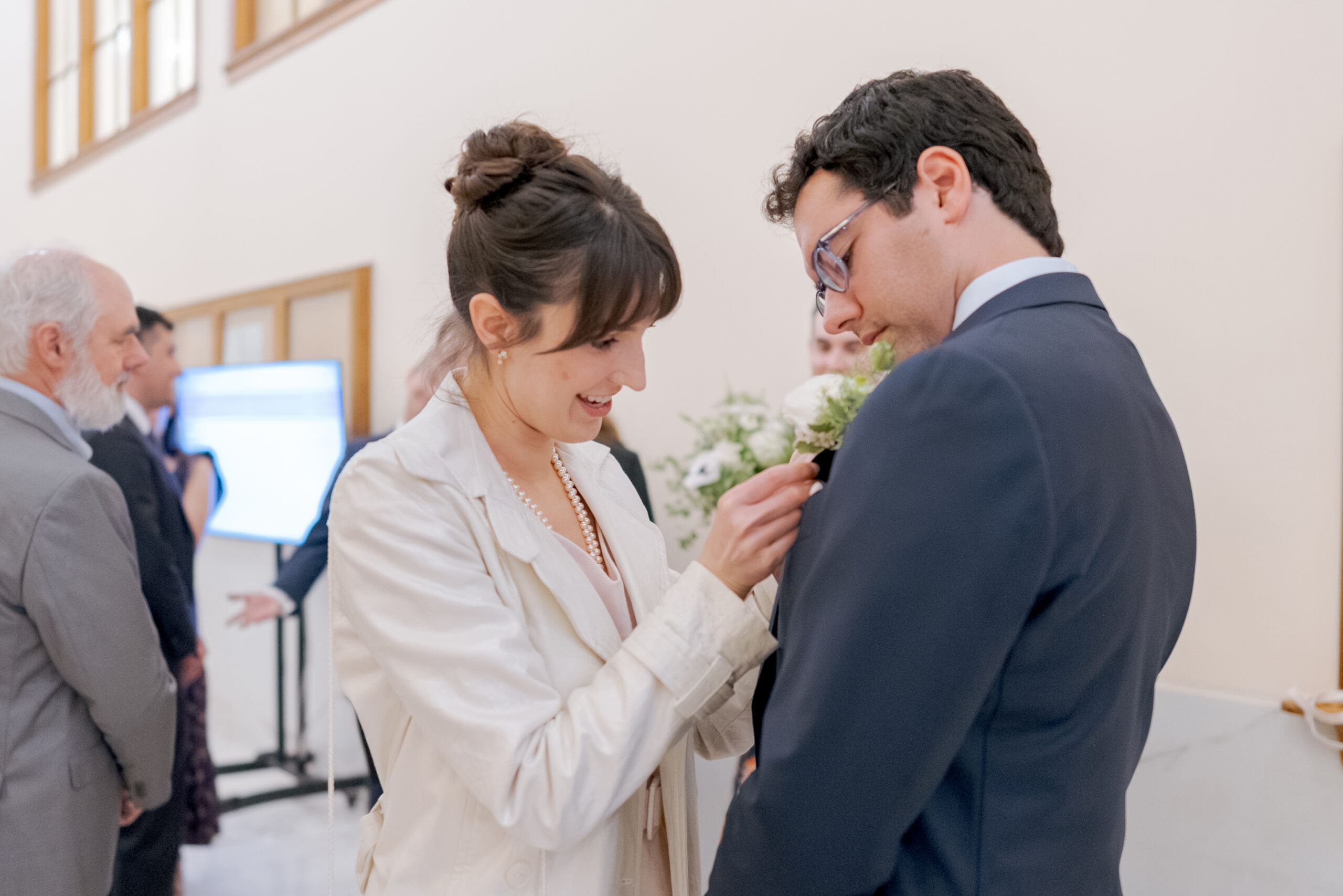 Candid moment between soon-to-be newlyweds while waiting for their turn at the Clerk's office at San Francisco City hall