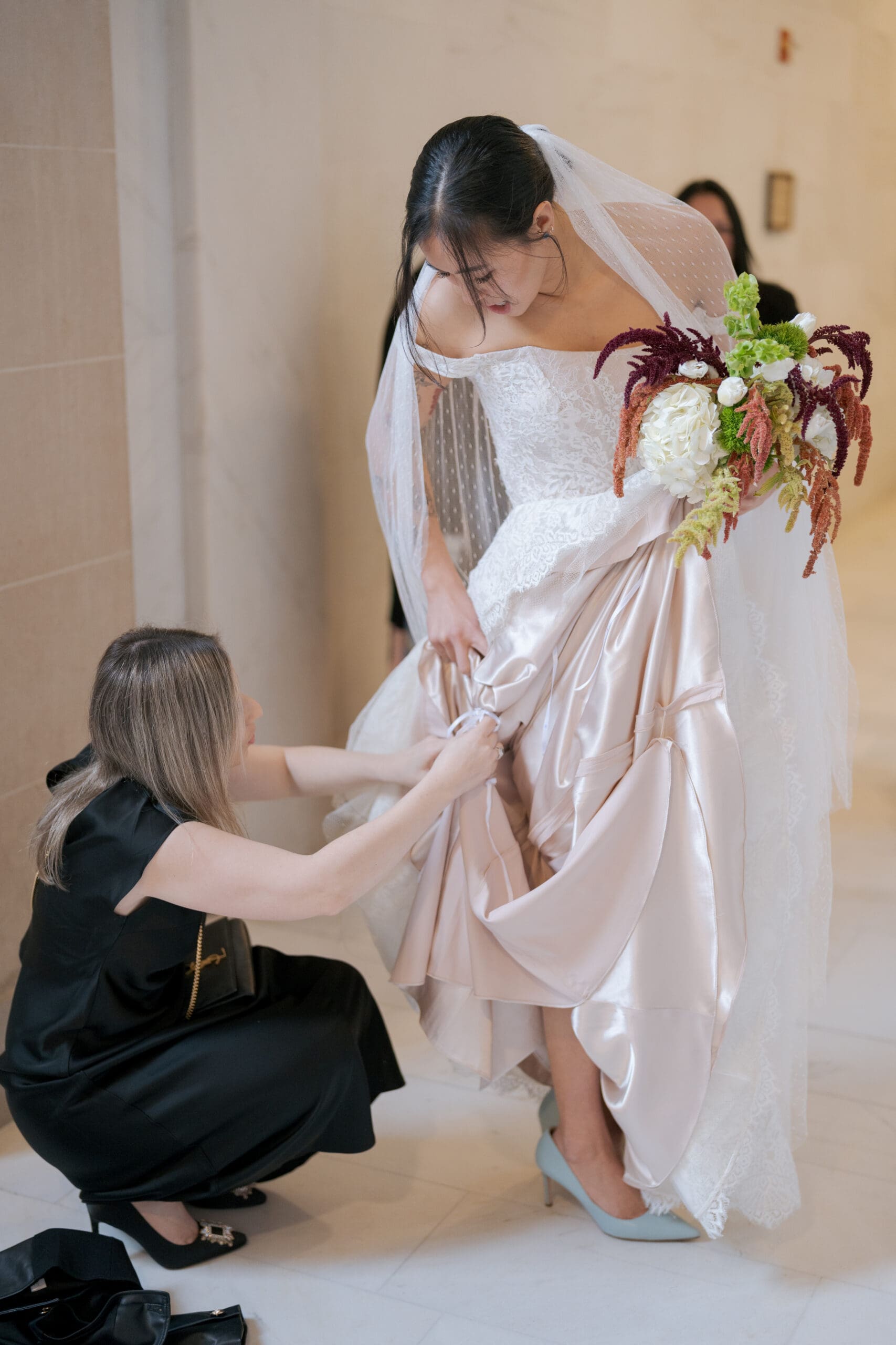 Detailed shot of bridal shoes on the iconic polished marble floors of San Francisco City Hall.