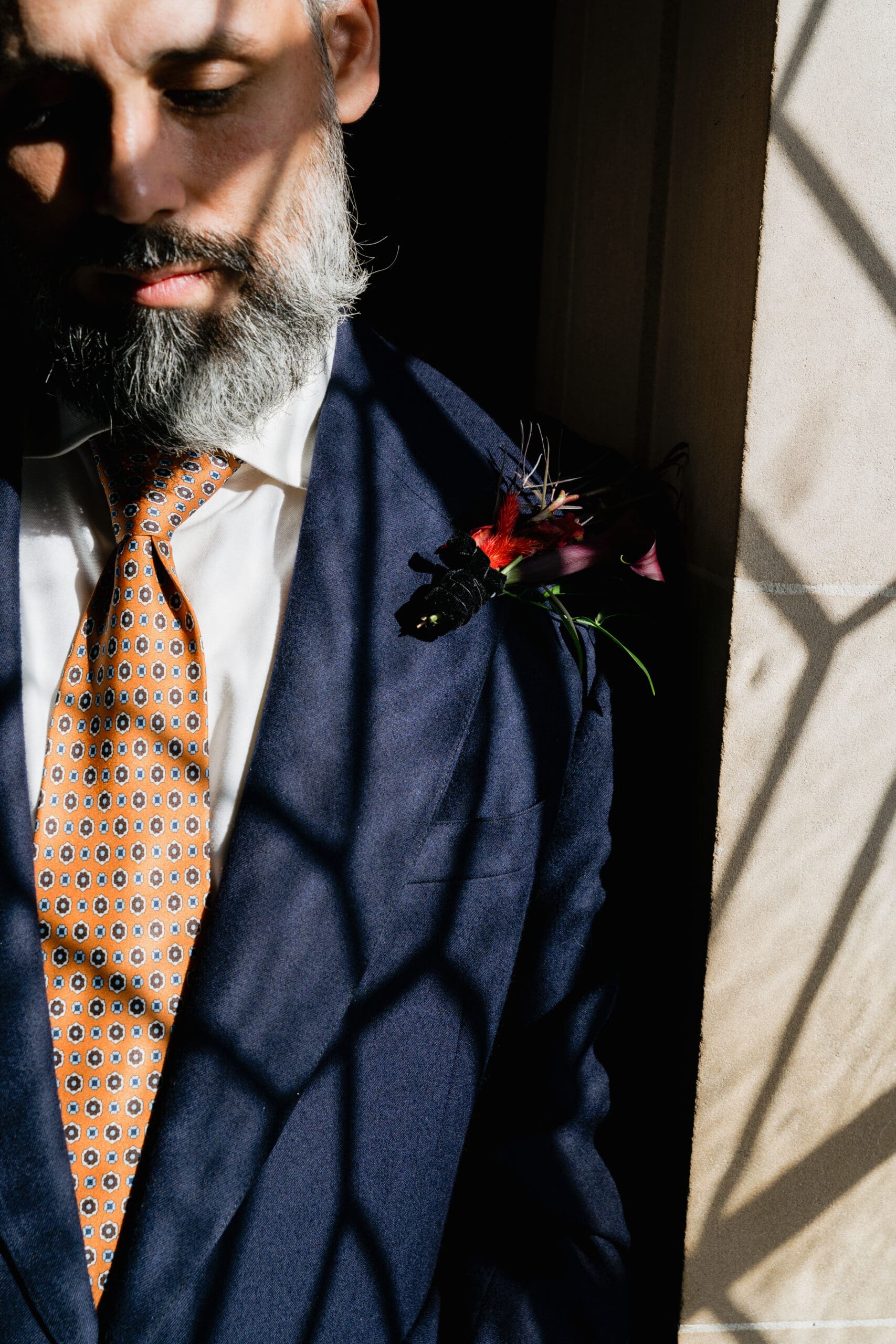 Groom in a tailored suit at SF City Hall.