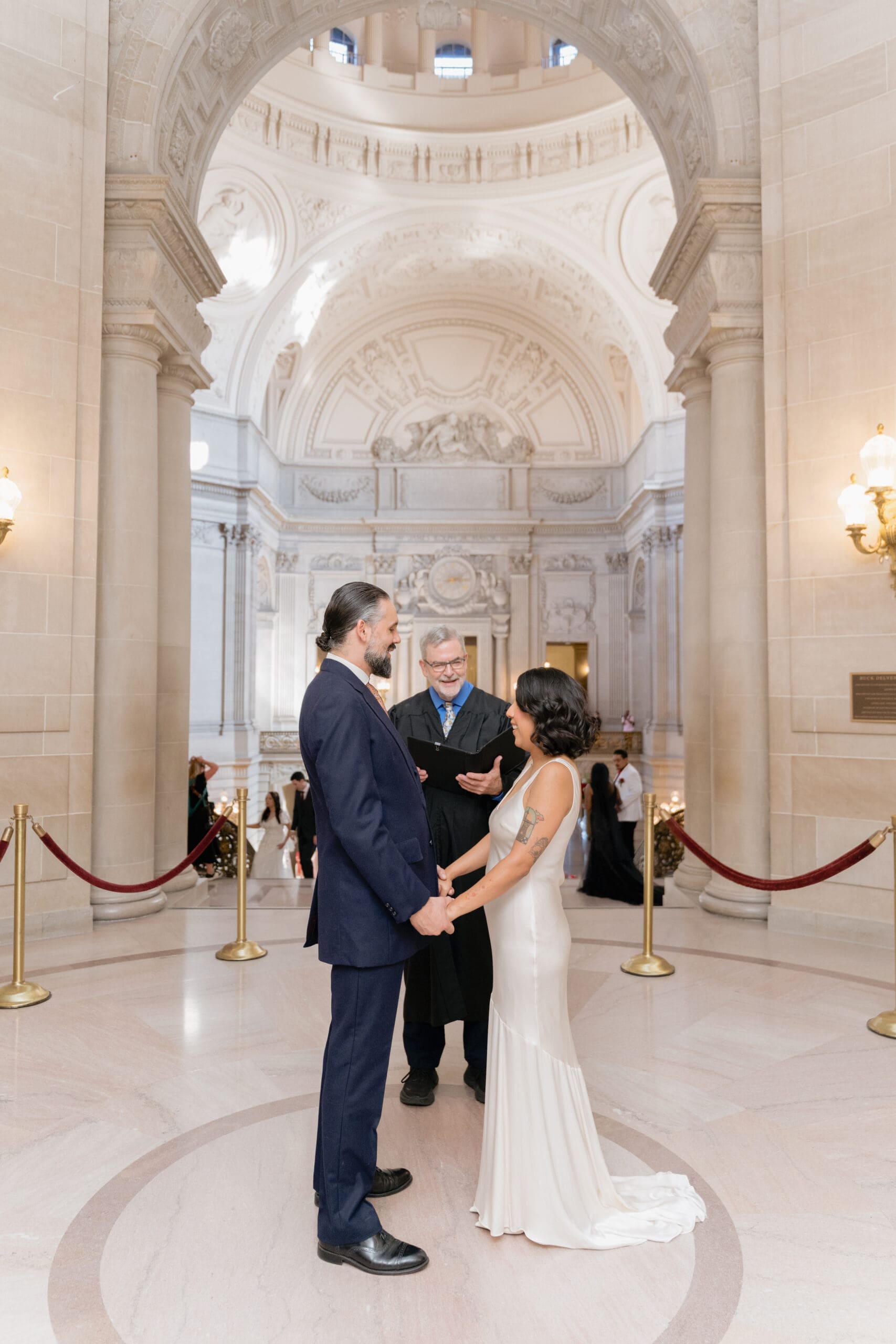 Bride and Groom during their San Francisco City Hall Civil Ceremony in the Rotunda, at the top of the grand staircase