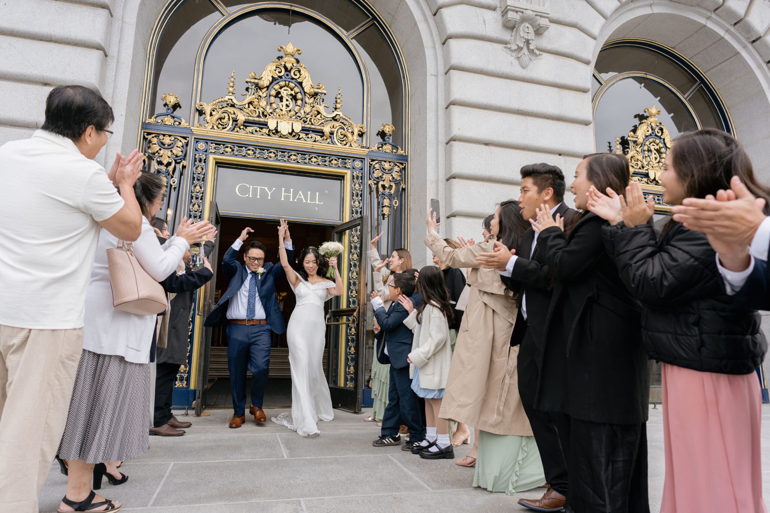 Newlyweds exit SF City Hall to cheering friends and family