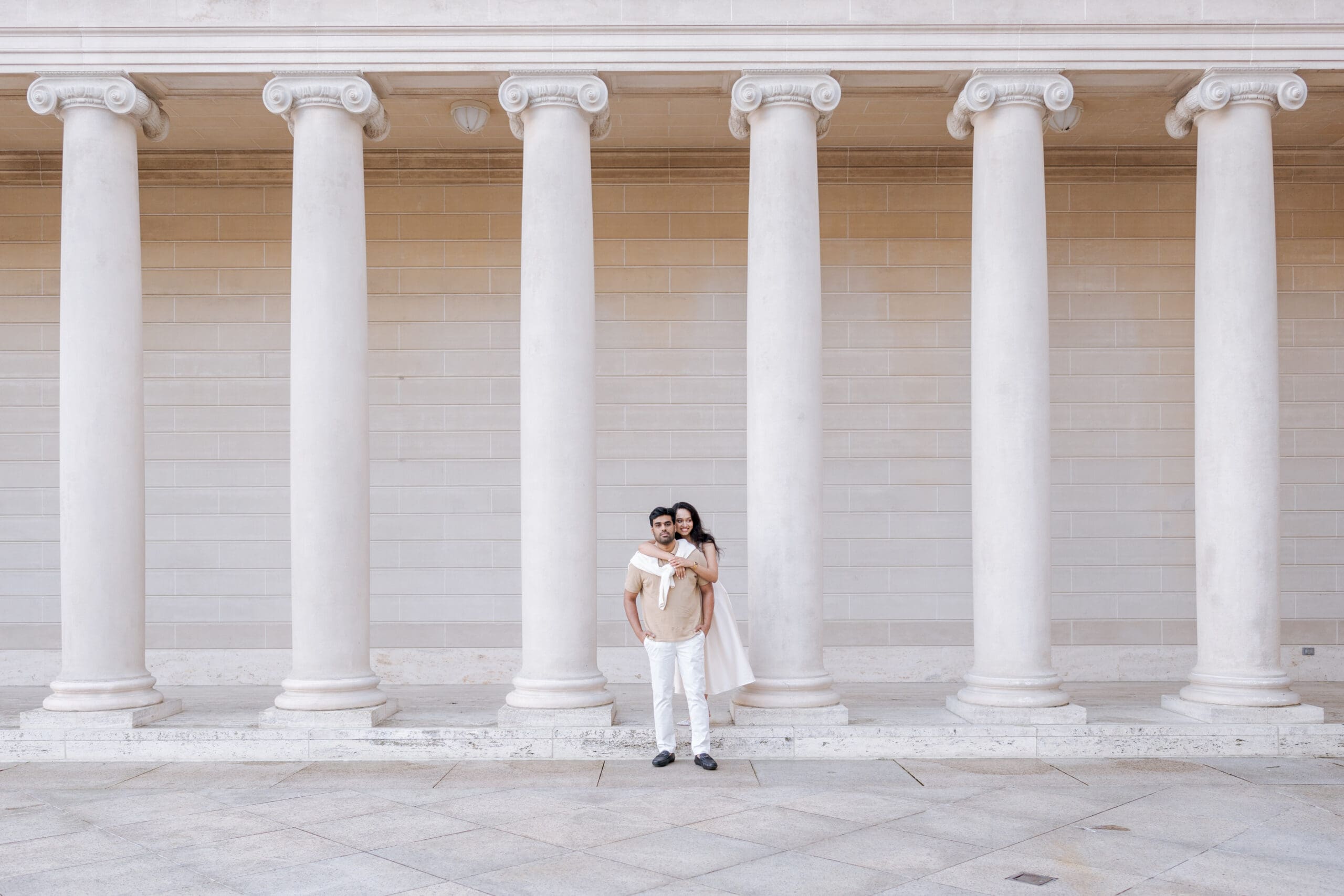 Happy engaged couple in the courtyard of the Legion of Honor Museum in San Francisco