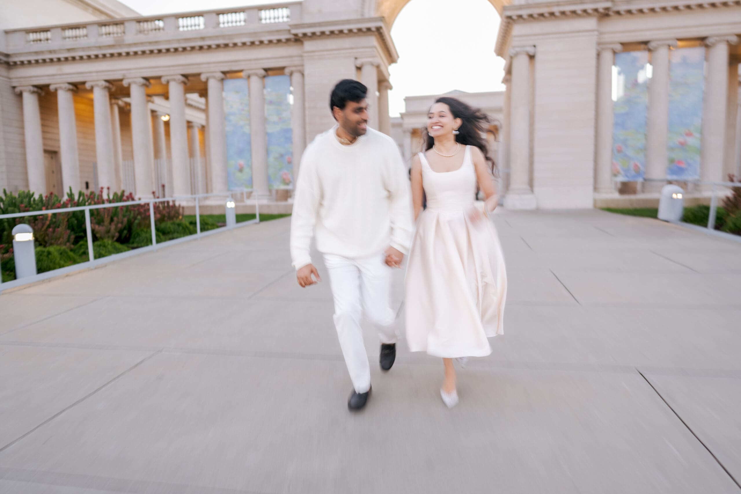 Motion blur photo of couple for an engagement photography session at the Legion of Honor museum in San Francisco