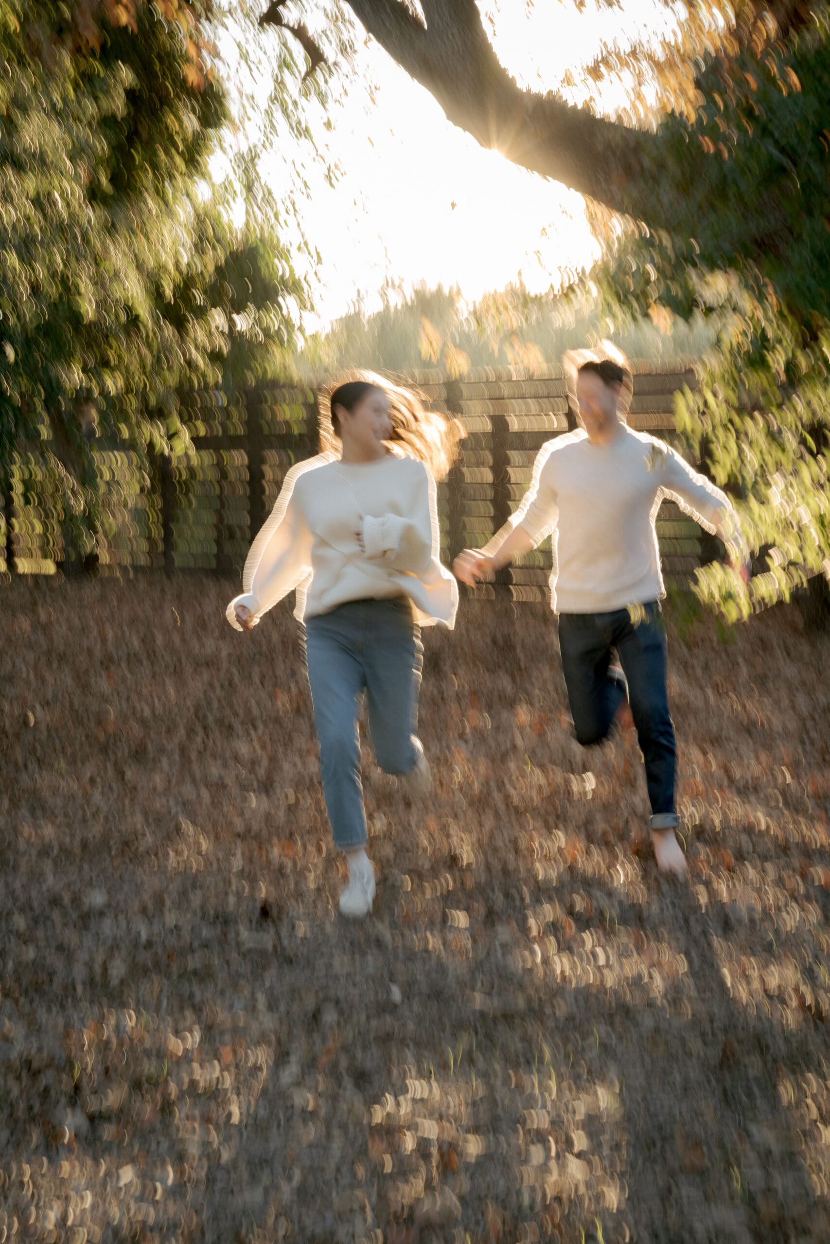 A fun intimate engagement photography session in a backyard during golden hour