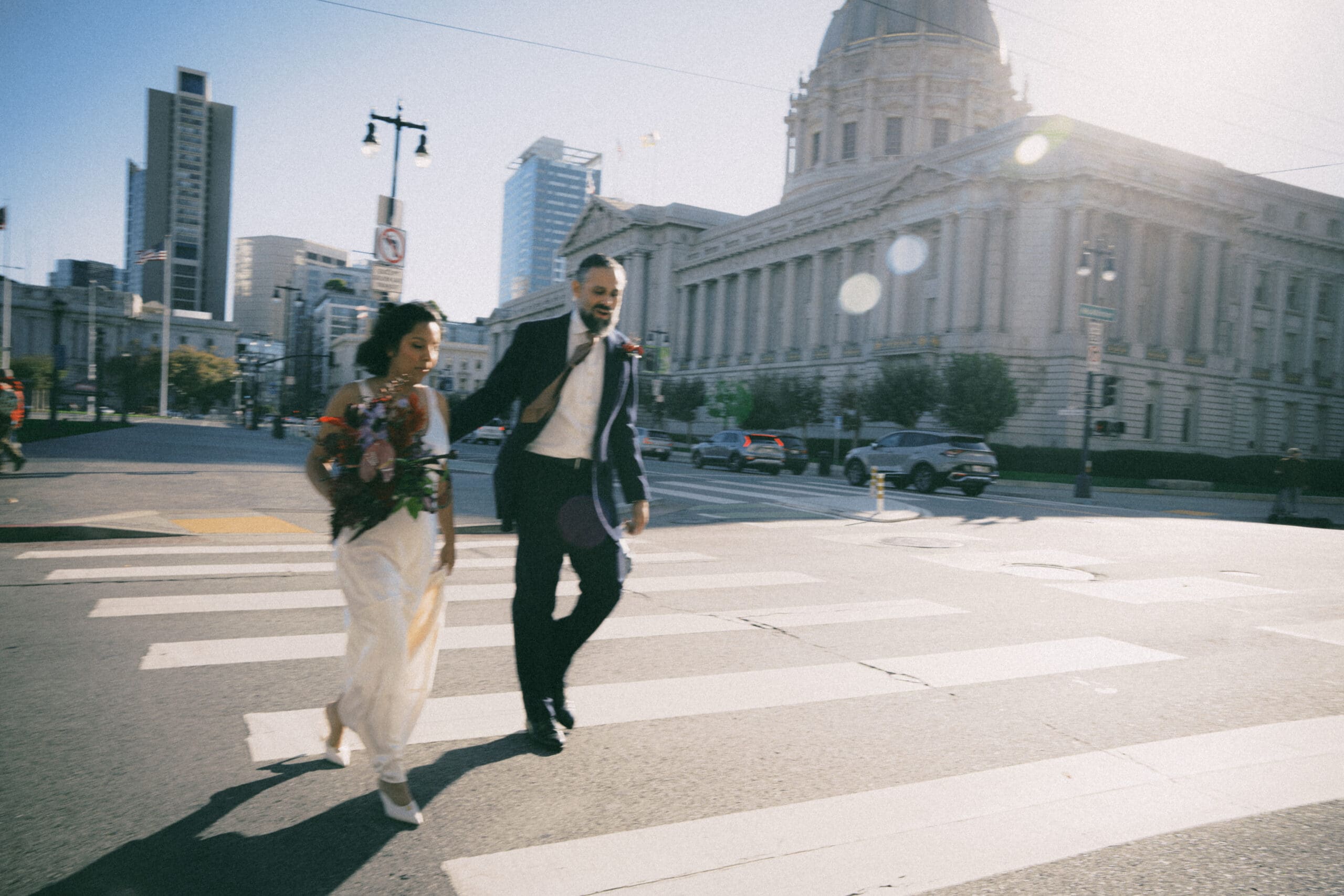 Wide shot capturing the scale and grandeur of the San Francisco City Hall rotunda.