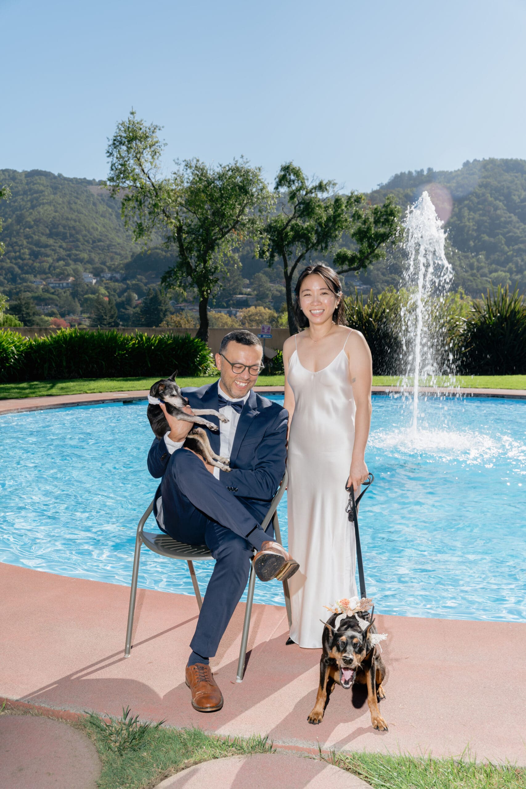 Portrait of a couple with their dogs at the Marin Civic Center garden and pool