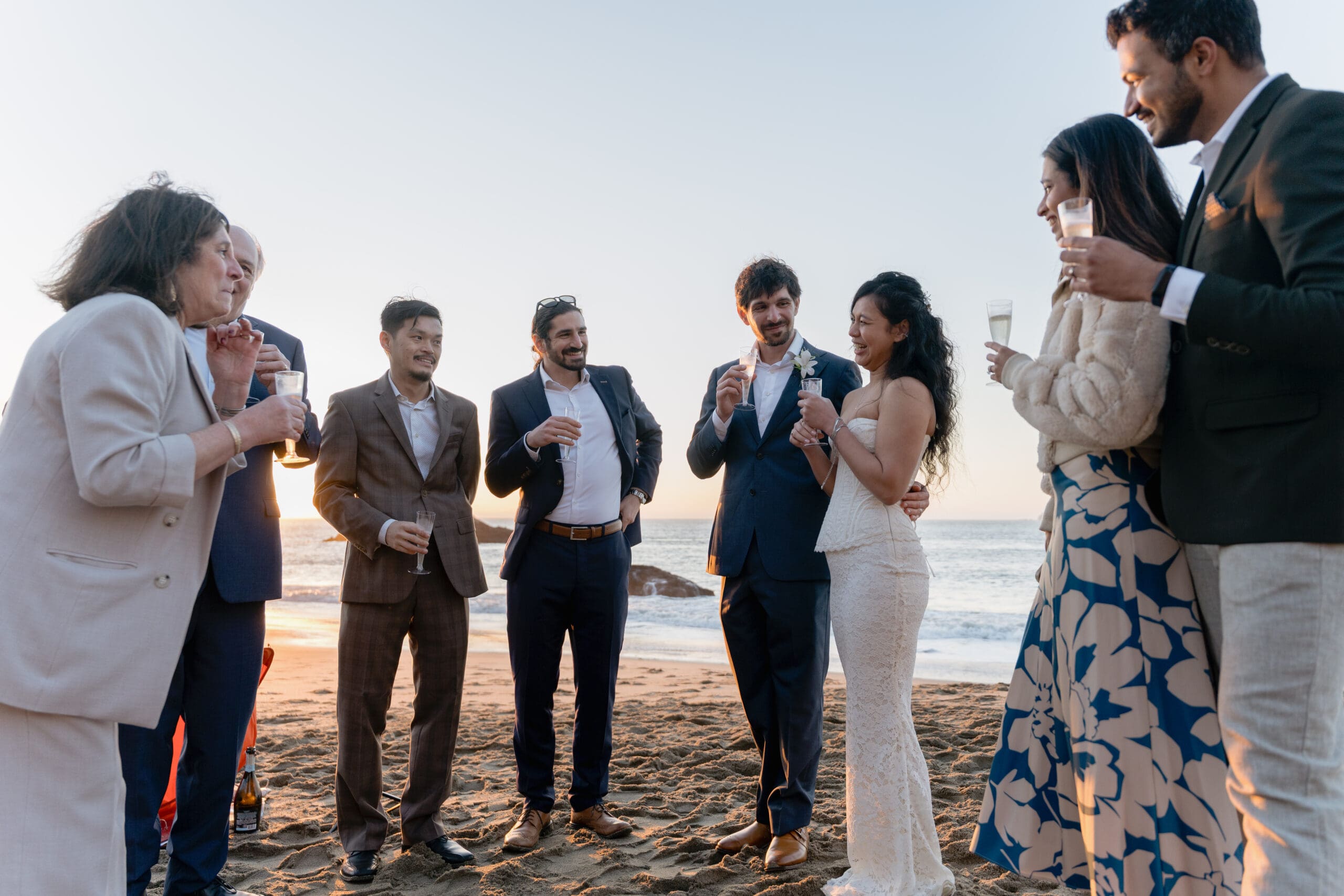 Joy and laughter with family and friends on Marshall's Beach as the sun sets in the background
