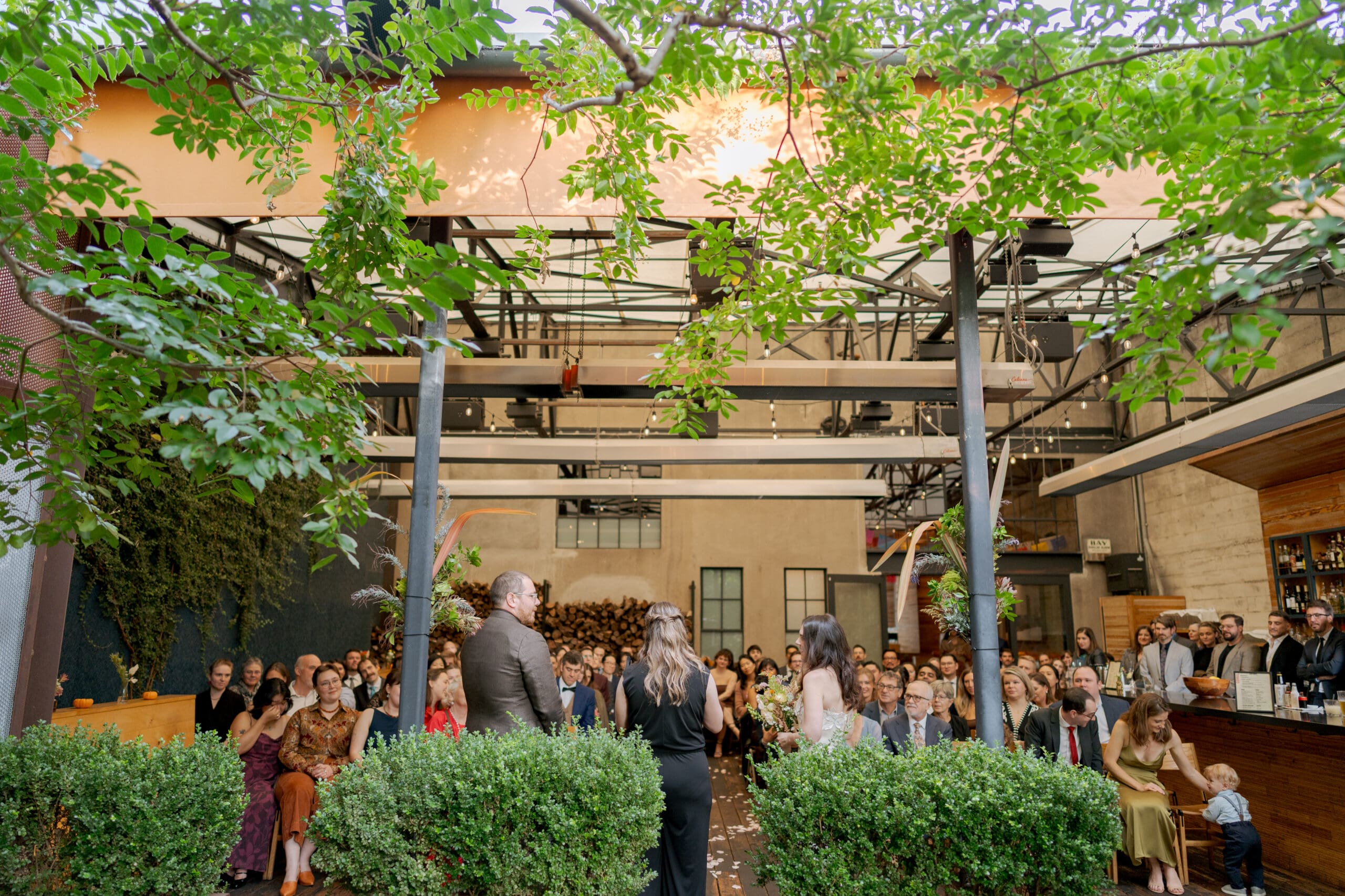 Wedding ceremony details and floral arrangements at an East Bay restaurant wedding.