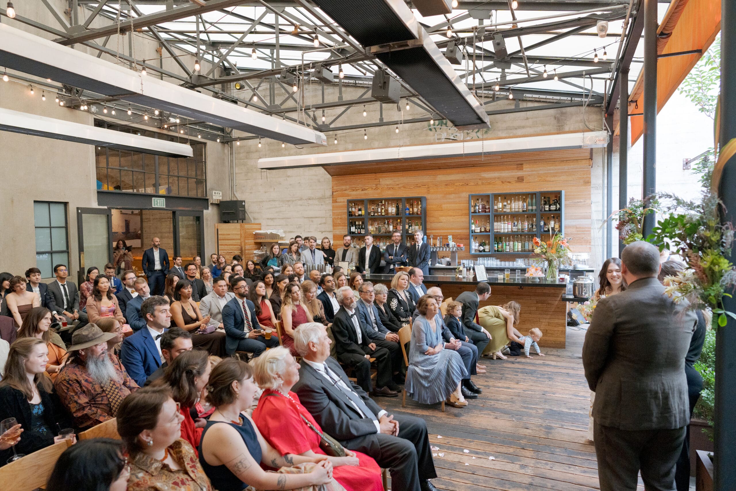 The outdoor ceremony space at Comal Berkeley under the protective architectural canopy.