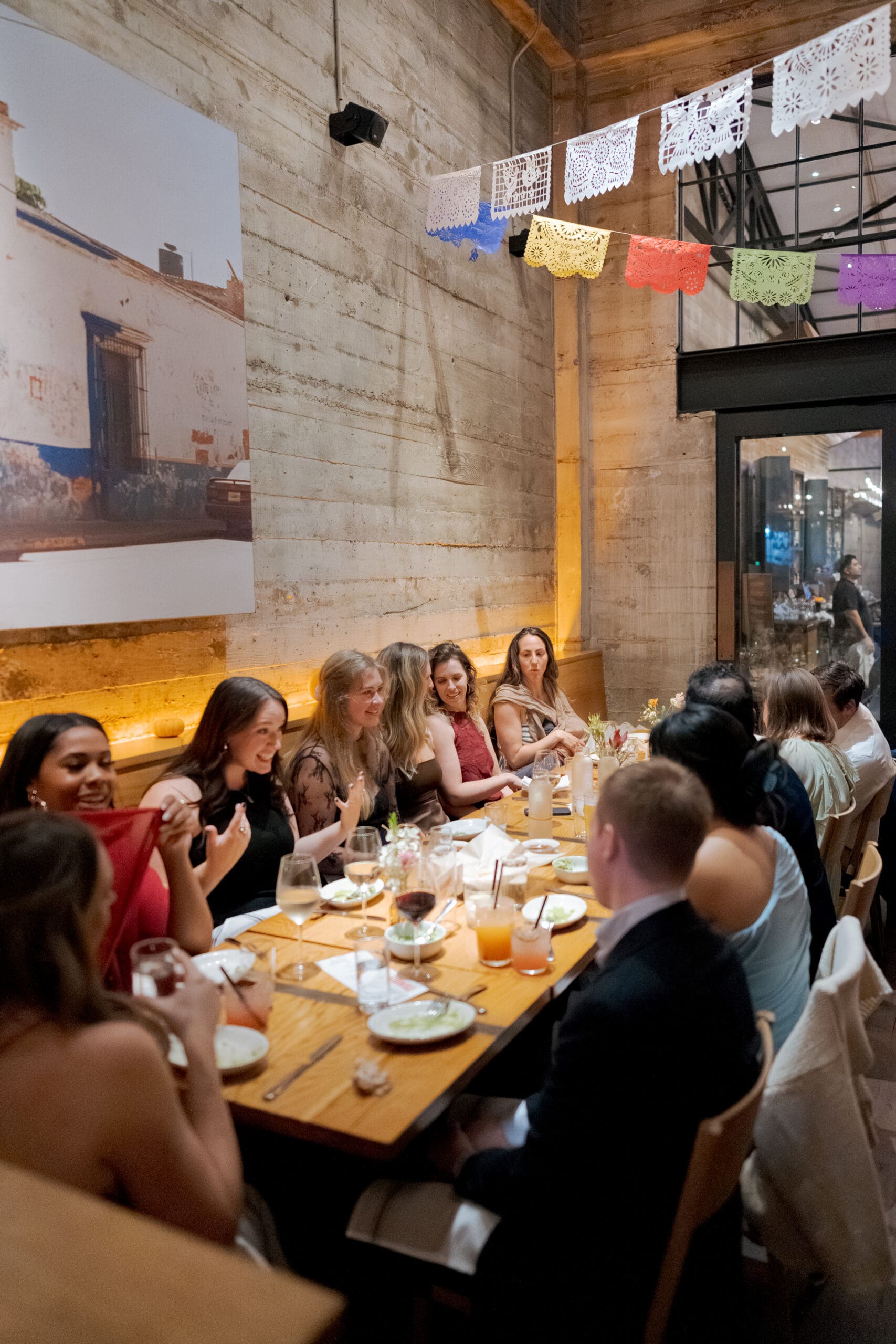Guests enjoying cocktails at a modern East Bay restaurant wedding reception.