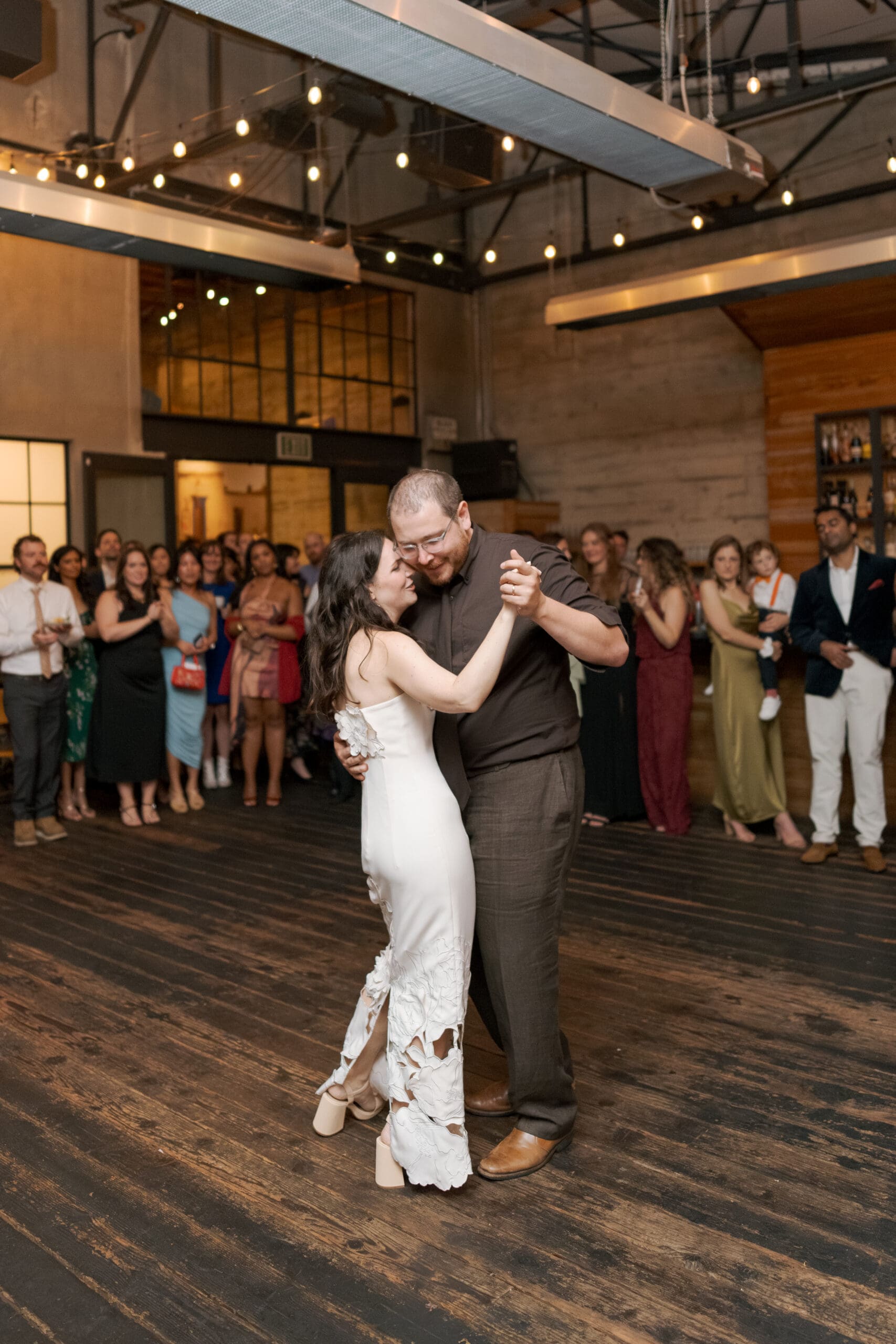 Bride and Groom share a first dance on the dance floor of Comal in downtown Berkeley