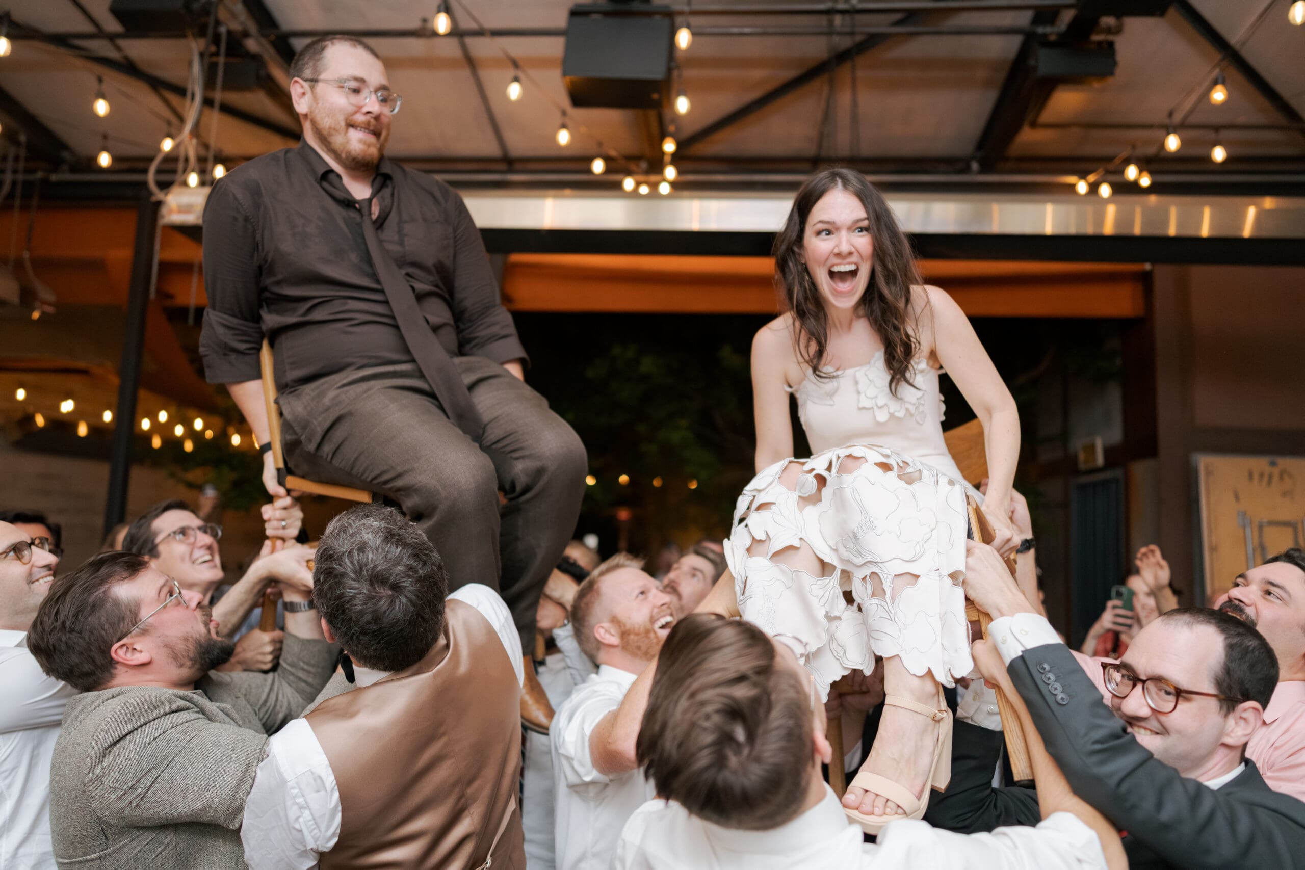 High-energy dancing and celebration at a Berkeley restaurant wedding.