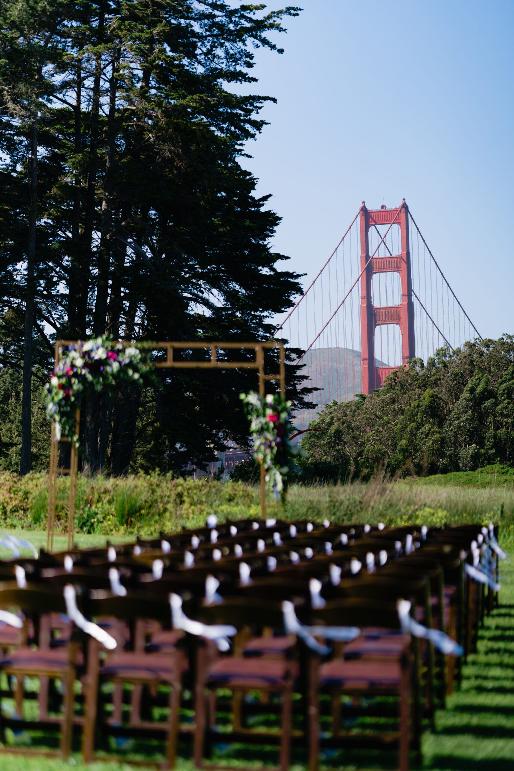 Ceremony details and setup with the Golden Gate Bridge in the background at the Wedgewood Presidio Log Cabin