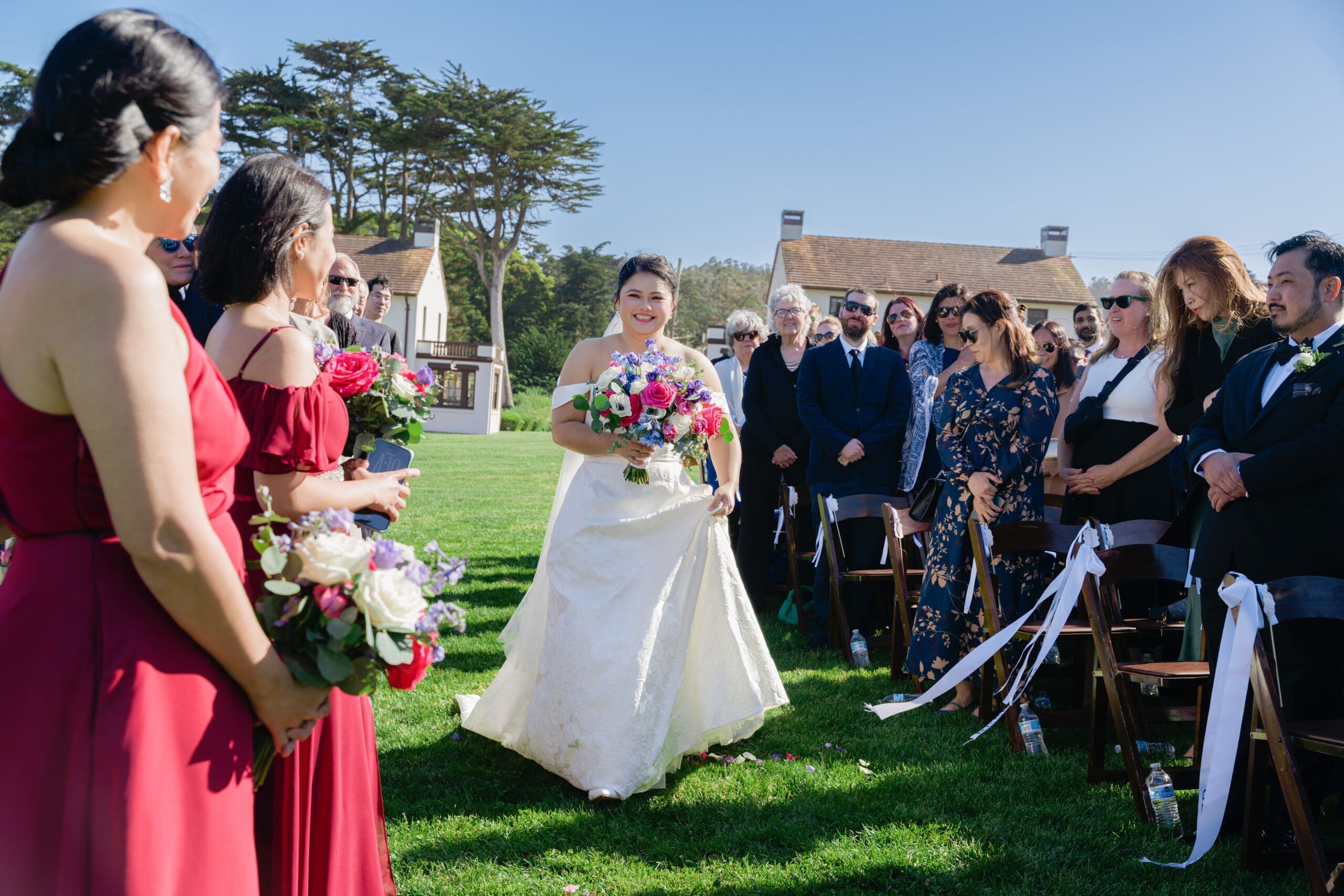 Bride walking down the aisle for the ceremony at the Presidio Log Cabin