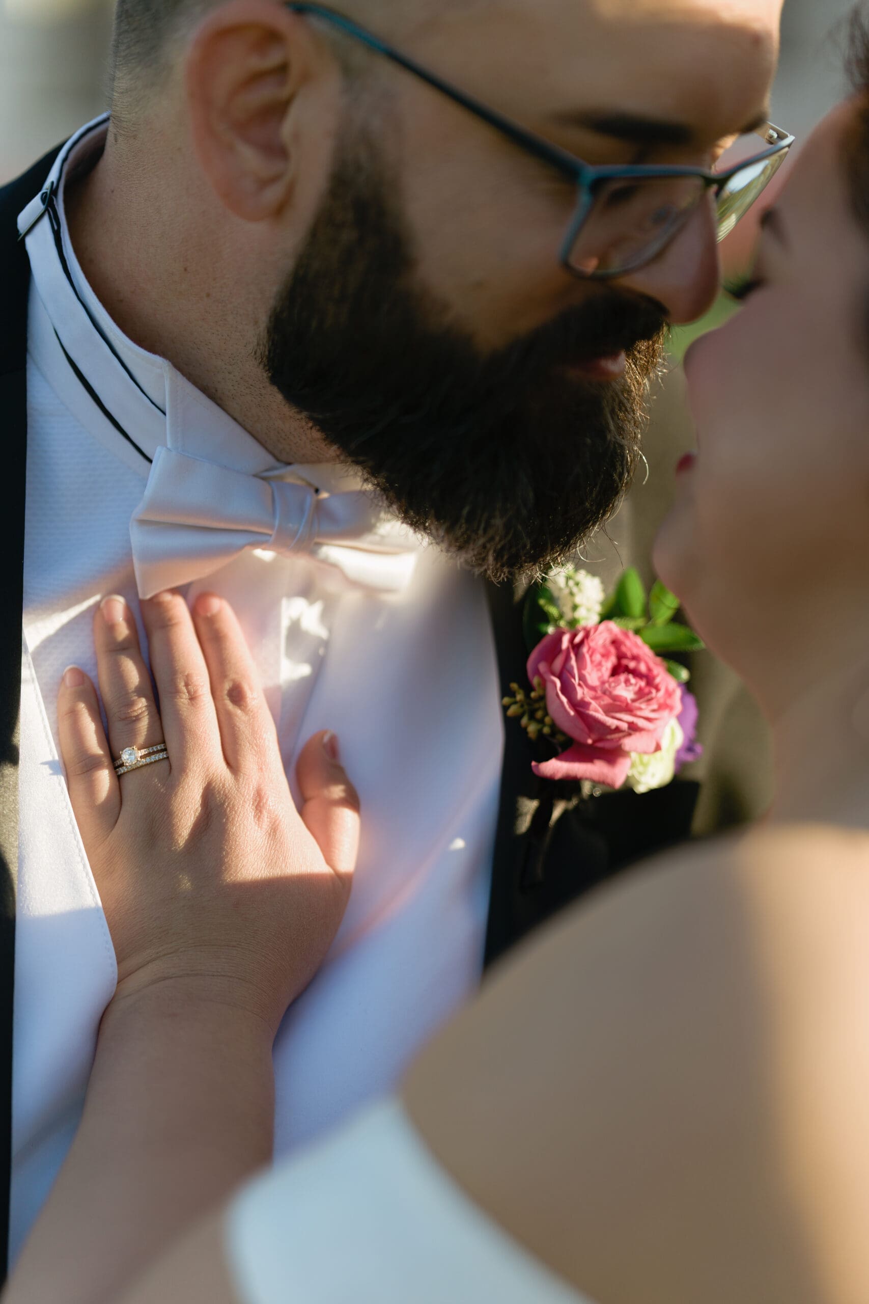 A tender embrace between bride and groom during golden hour in the Presidio