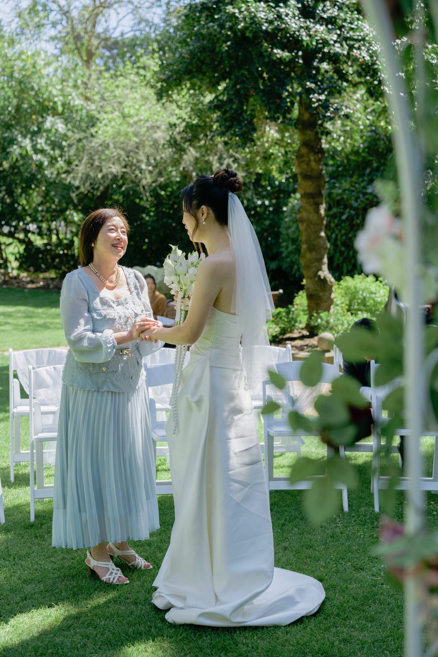 A tender candid moment with the bride and family member before the wedding ceremony in the Shakespeare Garden