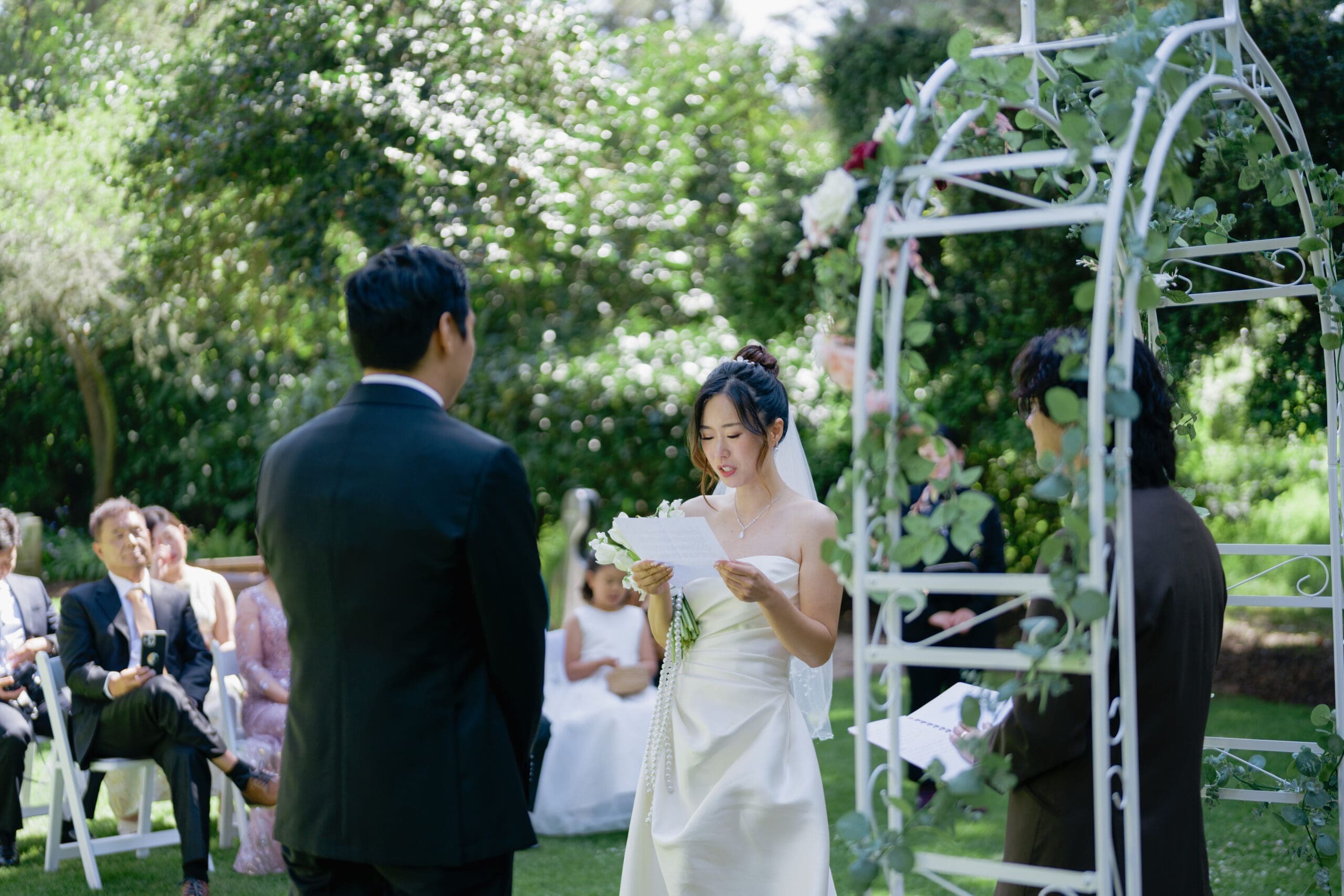 Bride reads her vows during outdoor ceremony in Golden Gate Park