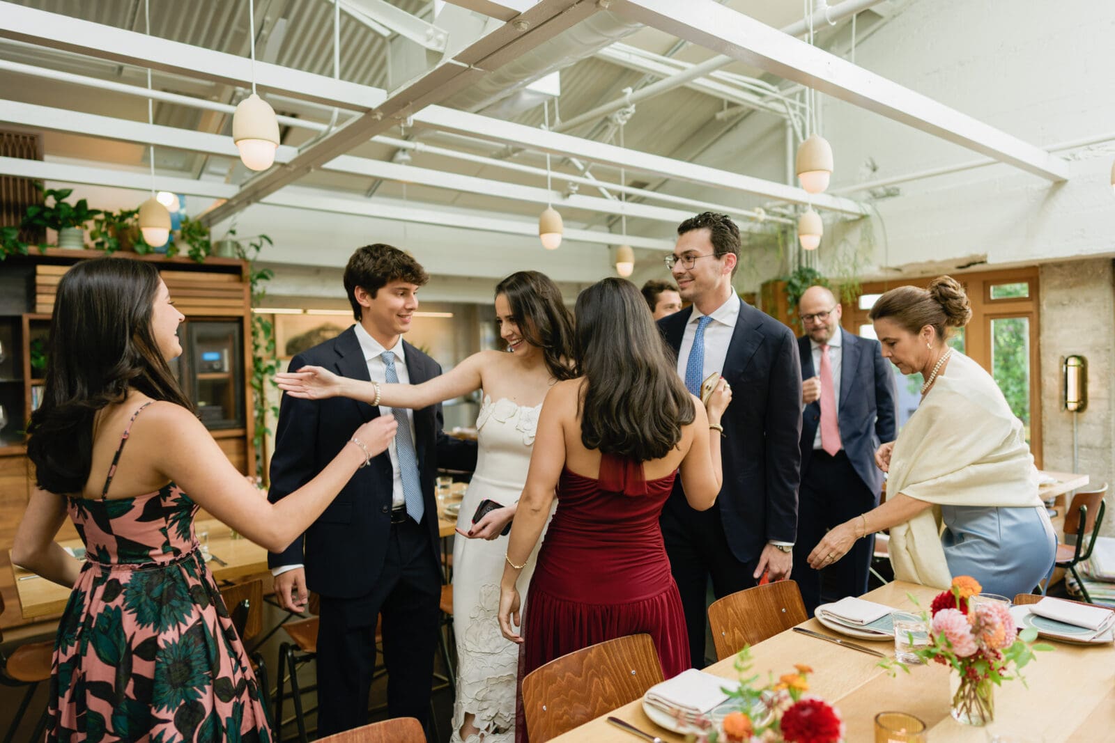 Wedding guests enjoying welcome drinks on the top floor at The Progress SF