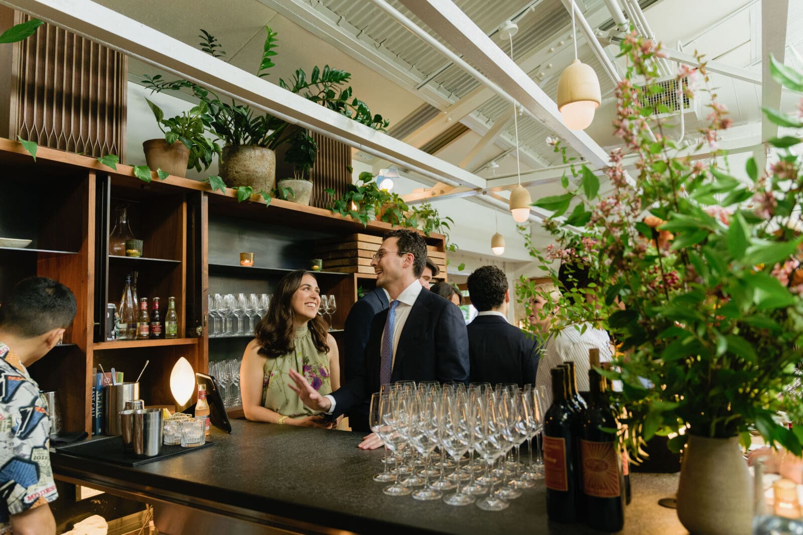 Wedding guests enjoying welcome cocktails on the top floor mezzanine at The Progress SF