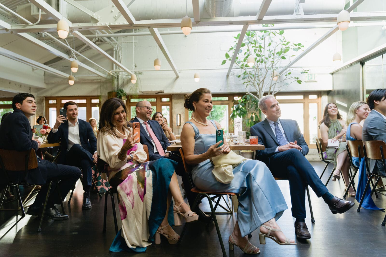 Family and close friends watching an intimate ceremony on the top floor at The Progress SF