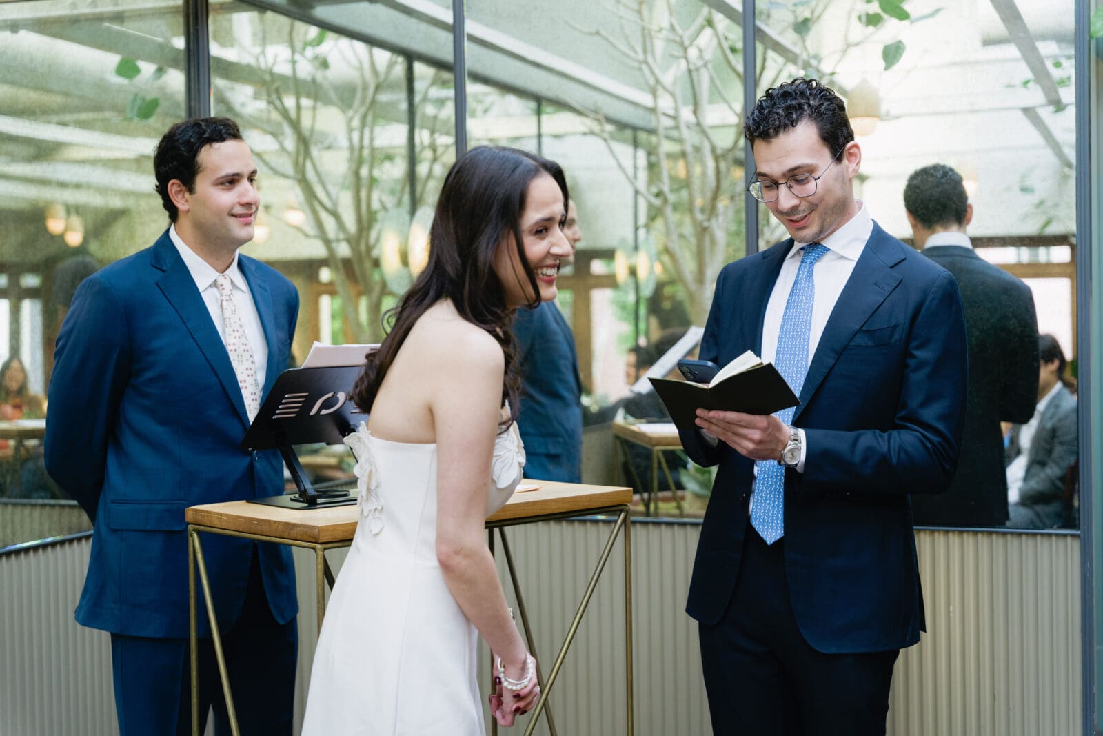 Close friend officiating a wedding ceremony in the upper private space at The Progress
