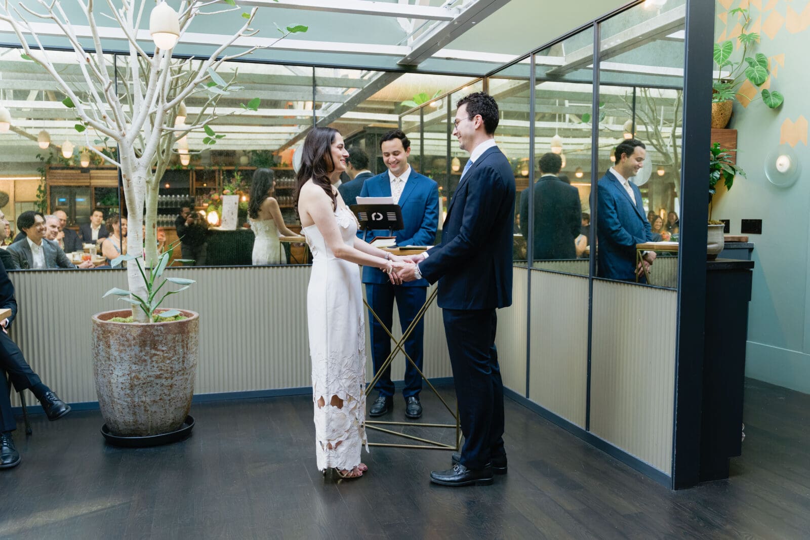 Couple holding hands during an intimate private ceremony at The Progress San Francisco