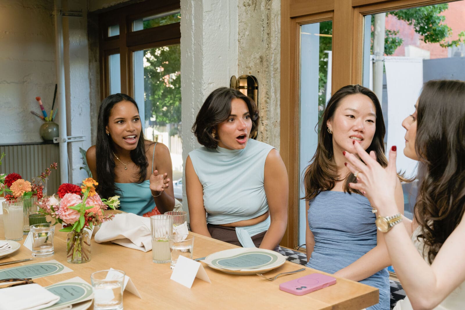 Unscripted moment of the couple celebrating with guests in the top floor private room
