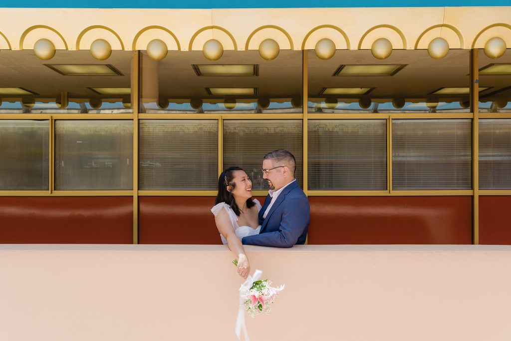 Wedding portraits of bride and groom in the top floor of Marin County Civic Center
